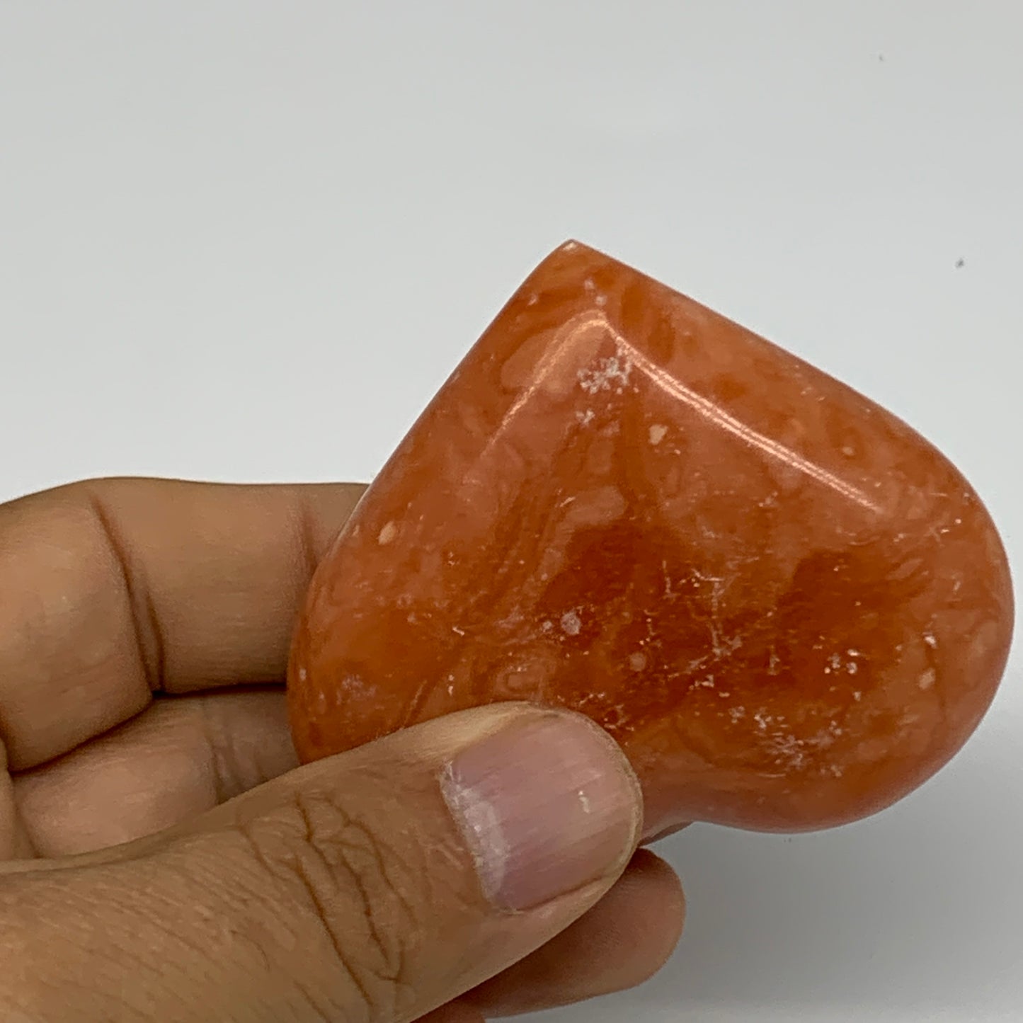 96.8g,2.1"x2.4"x1" Orange Calcite Heart Gemstones from Madagascar, B33803