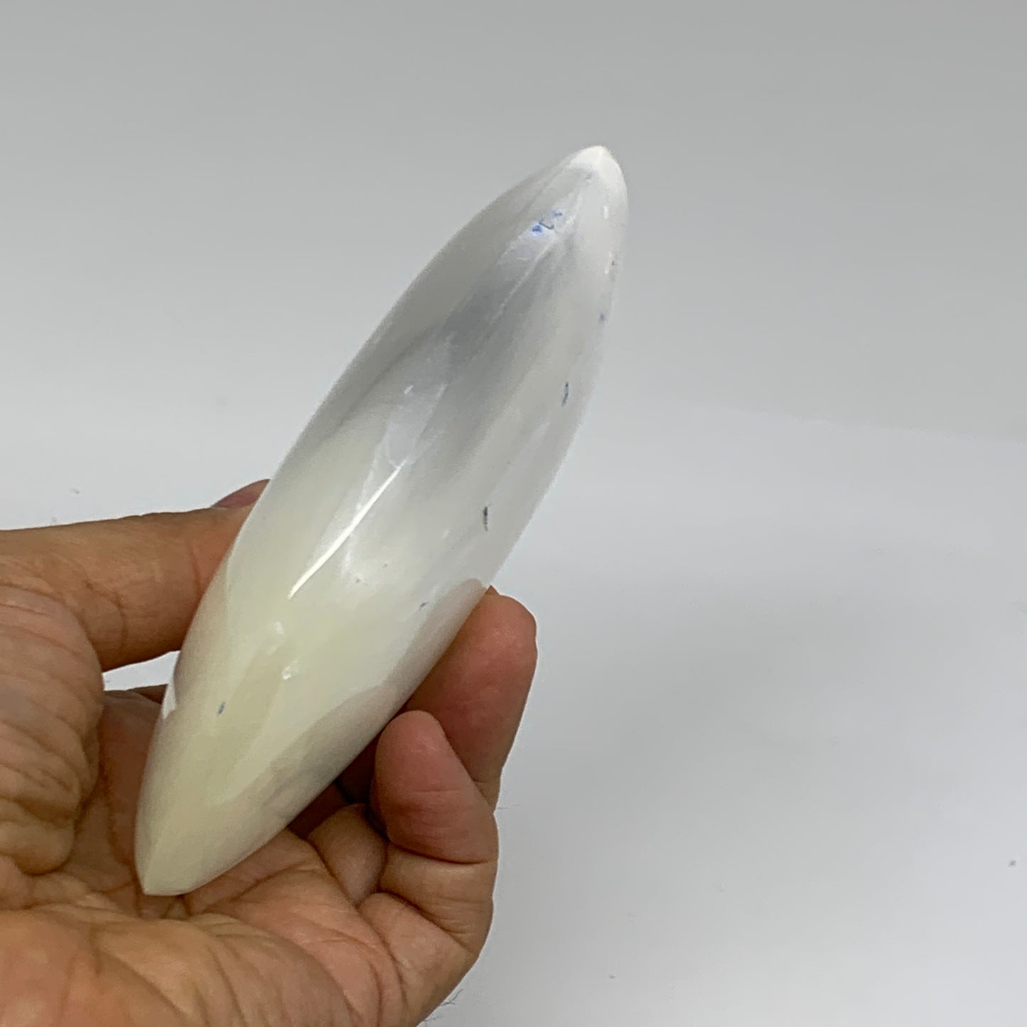 0.95 lbs, 5.2"x3.5"x1.3", White Selenite Palmstone Crystal Pillow Reiki, B35917