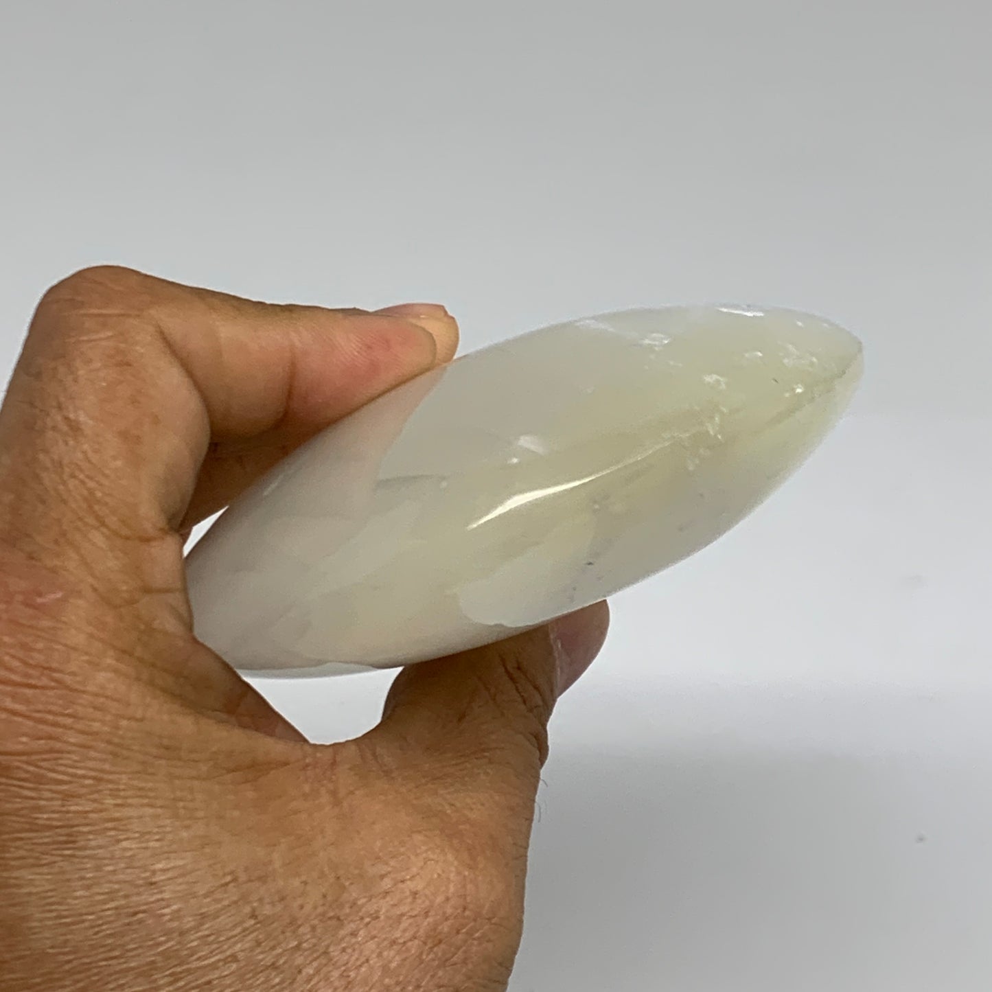 0.95 lbs, 5.2"x3.5"x1.3", White Selenite Palmstone Crystal Pillow Reiki, B35917