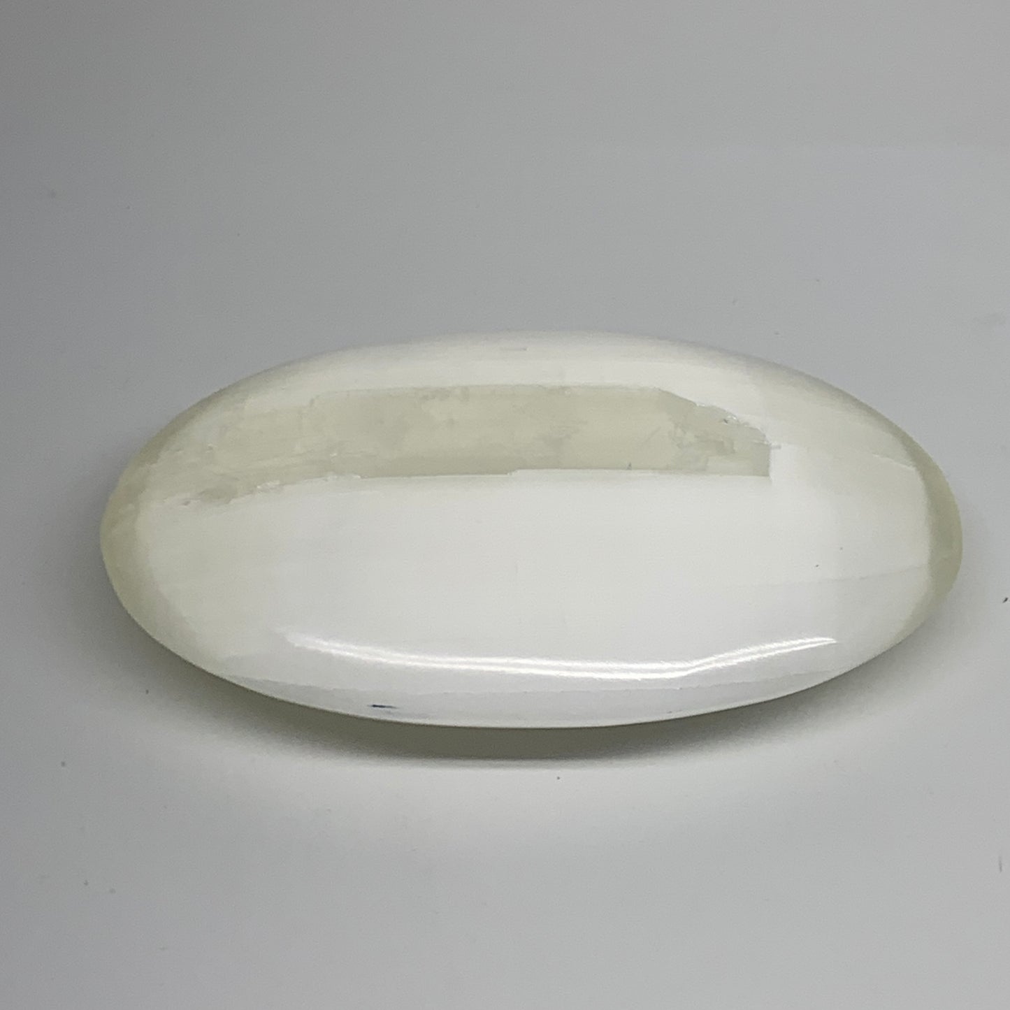 0.95 lbs, 5.2"x3.5"x1.3", White Selenite Palmstone Crystal Pillow Reiki, B35917