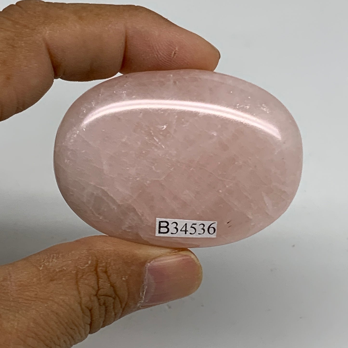 68.2g , 2.2"x1.6"x0.7", Natural Pink Rose Quartz Palm-stone Crystal, B34536