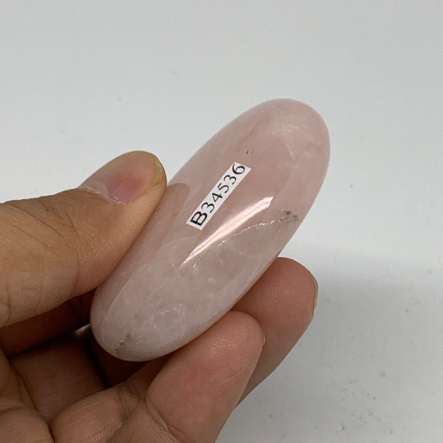 68.2g , 2.2"x1.6"x0.7", Natural Pink Rose Quartz Palm-stone Crystal, B34536