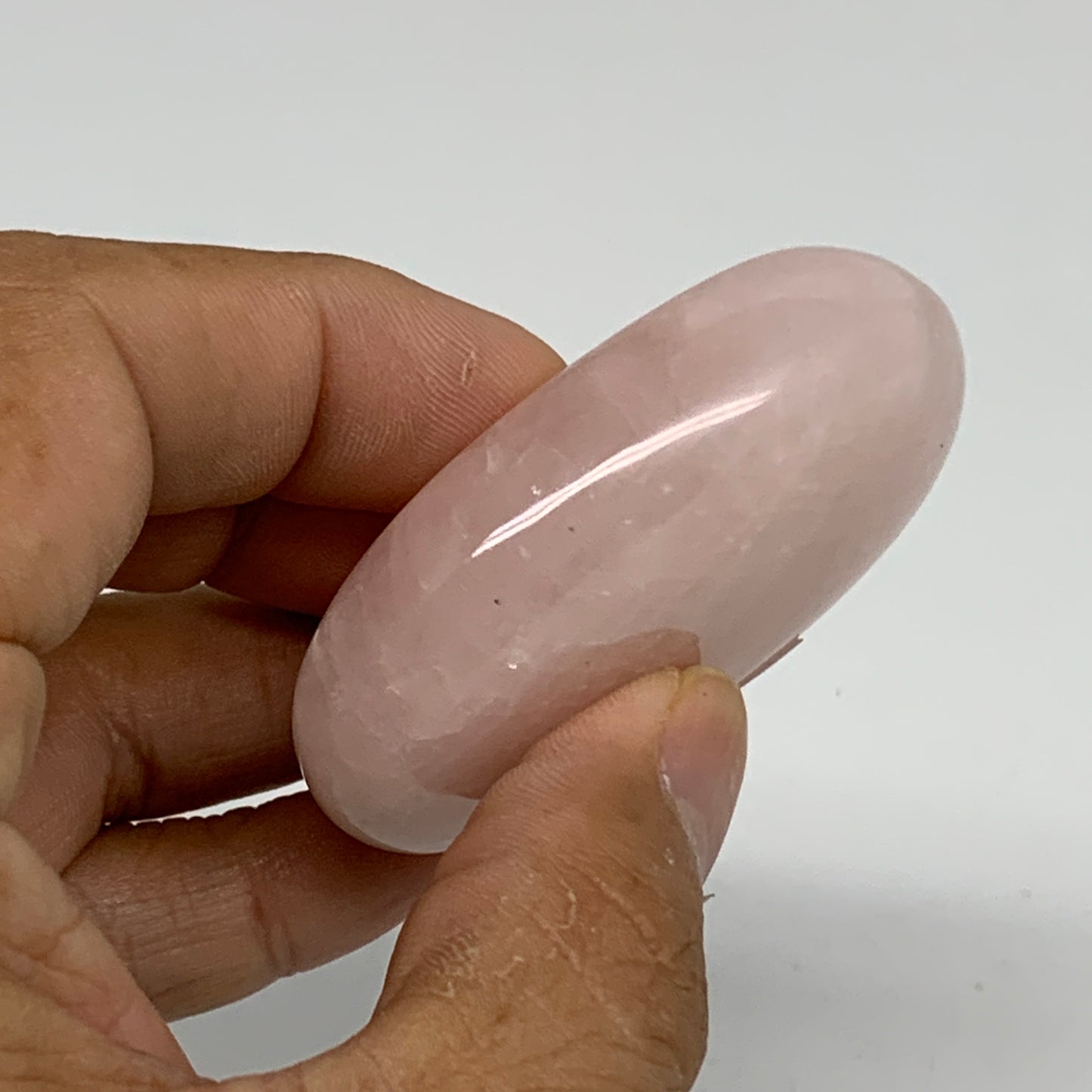 68.2g , 2.2"x1.6"x0.7", Natural Pink Rose Quartz Palm-stone Crystal, B34536