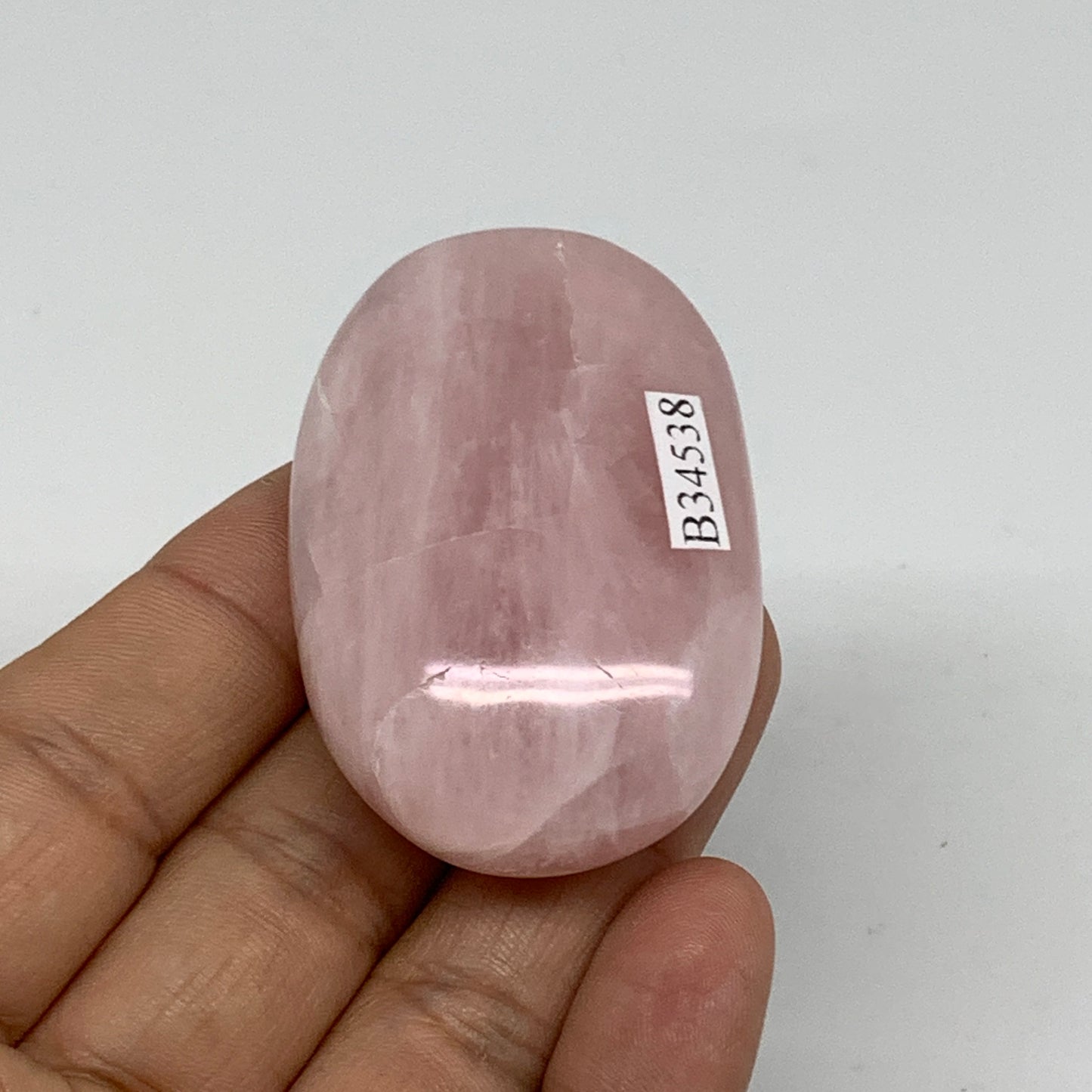 62.1g , 2.1"x1.4"x0.8", Natural Pink Rose Quartz Palm-stone Crystal, B34538