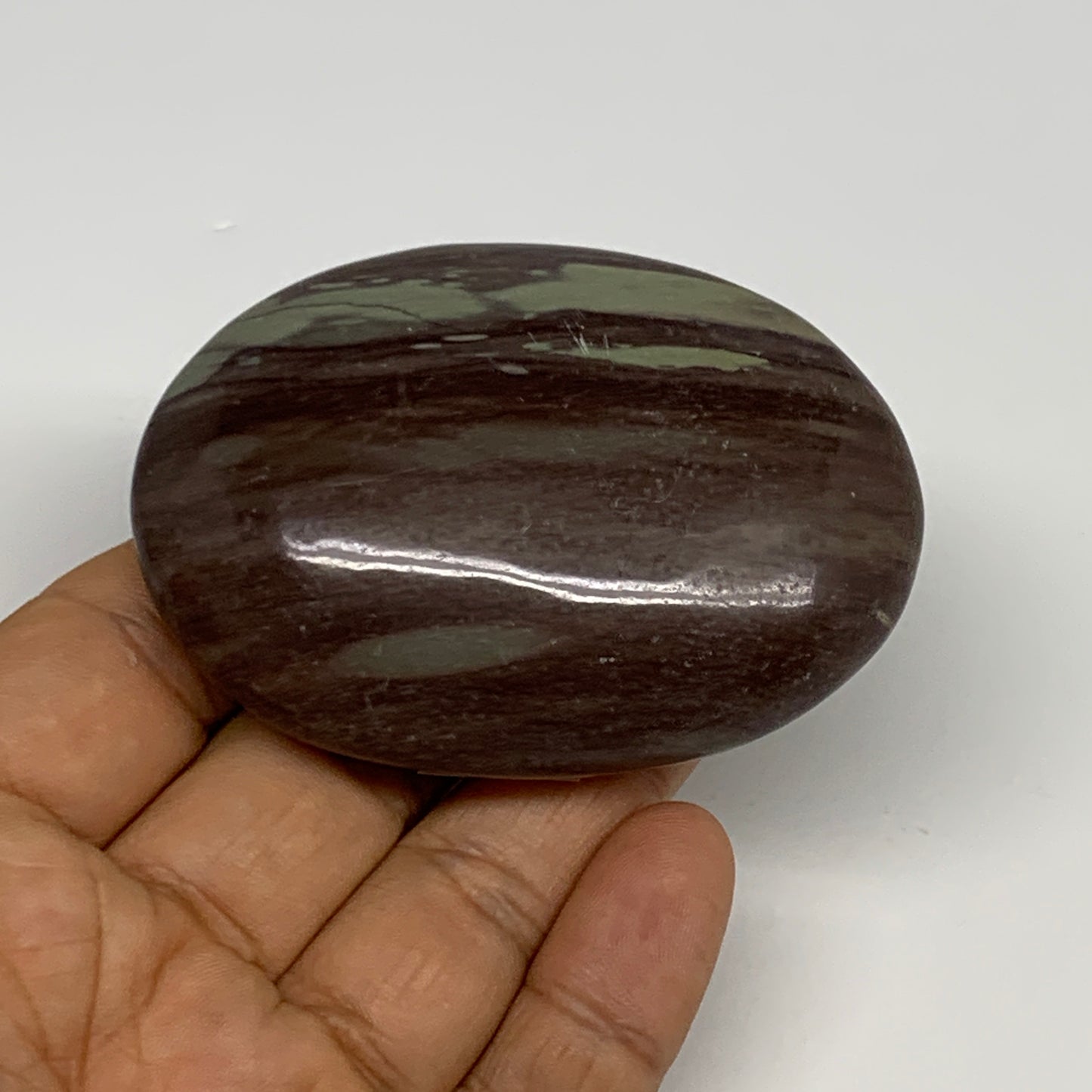 117.1g, 2.8"x2"x0.9", Narmada Shiva Lingam Palm-Stone Polished, B29385