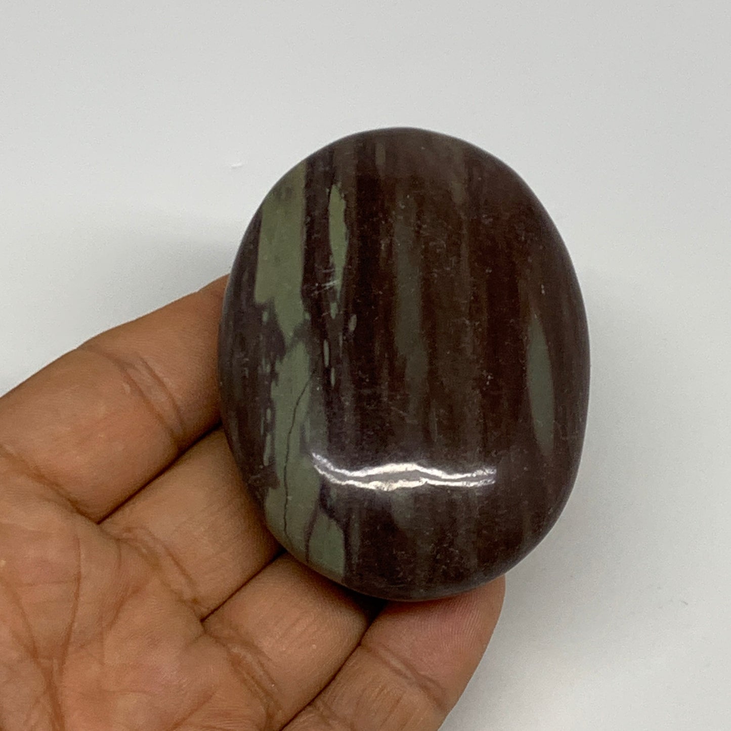 117.1g, 2.8"x2"x0.9", Narmada Shiva Lingam Palm-Stone Polished, B29385