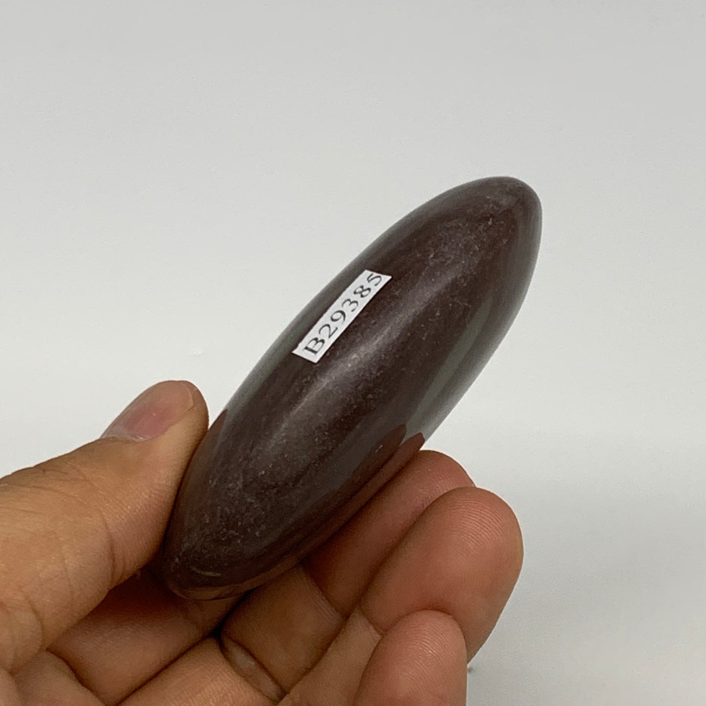 117.1g, 2.8"x2"x0.9", Narmada Shiva Lingam Palm-Stone Polished, B29385