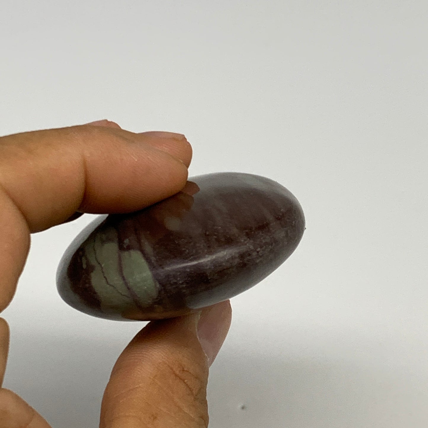 117.1g, 2.8"x2"x0.9", Narmada Shiva Lingam Palm-Stone Polished, B29385