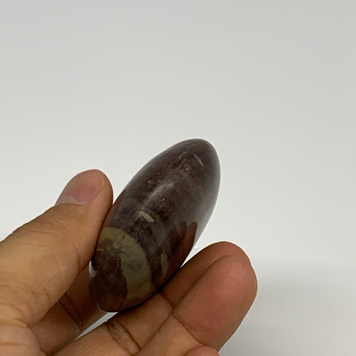 117.1g, 2.8"x2"x0.9", Narmada Shiva Lingam Palm-Stone Polished, B29385