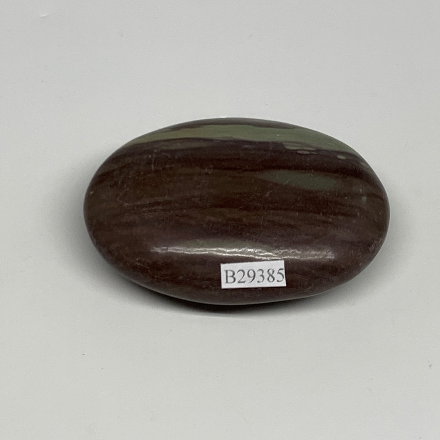 117.1g, 2.8"x2"x0.9", Narmada Shiva Lingam Palm-Stone Polished, B29385