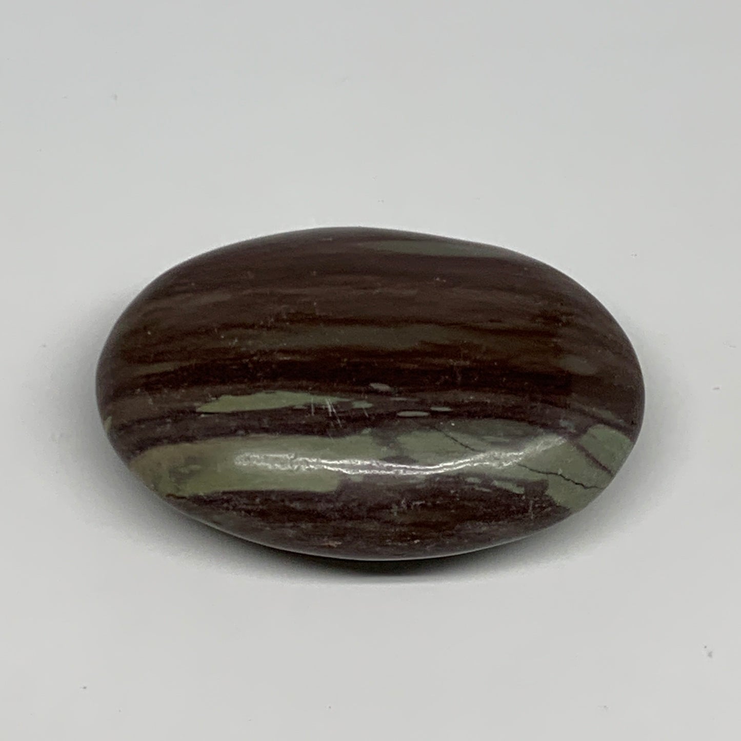 117.1g, 2.8"x2"x0.9", Narmada Shiva Lingam Palm-Stone Polished, B29385