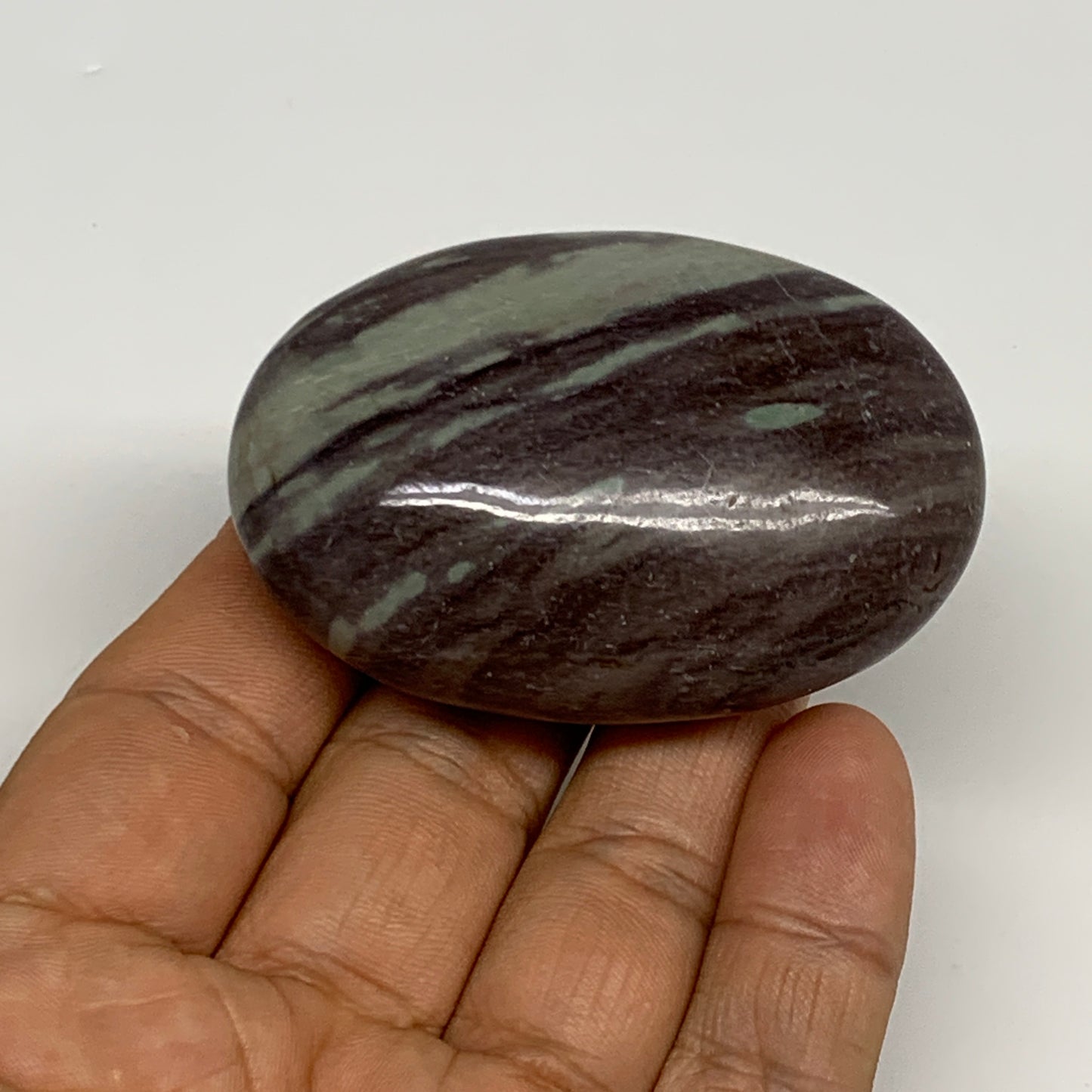 84.8g, 2.4"x1.6"x0.9", Narmada Shiva Lingam Palm-Stone Polished, B29387