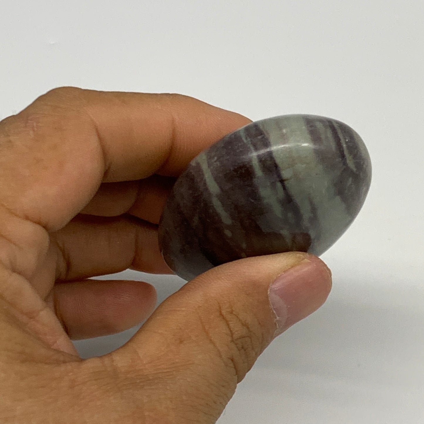 84.8g, 2.4"x1.6"x0.9", Narmada Shiva Lingam Palm-Stone Polished, B29387