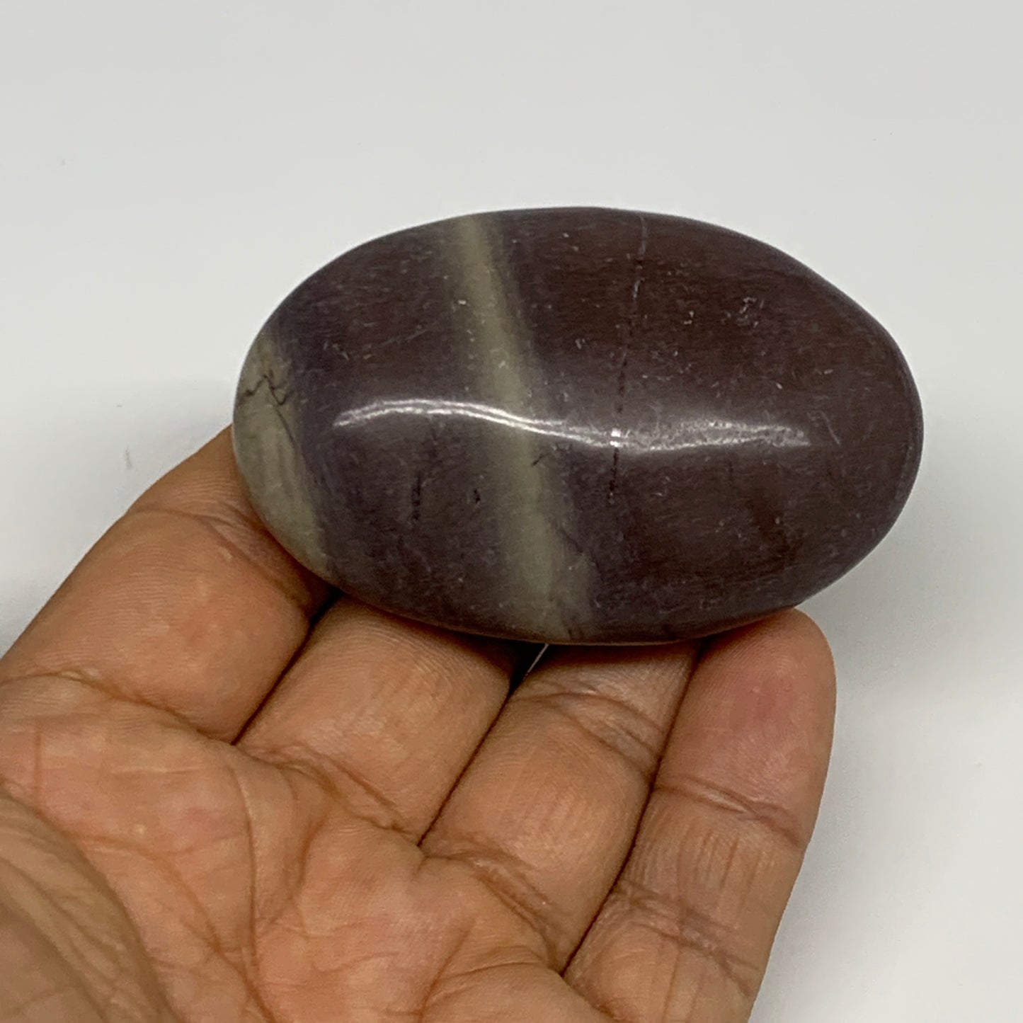 81.3g, 2.5"x1.6"x0.9", Narmada Shiva Lingam Palm-Stone Polished, B29389