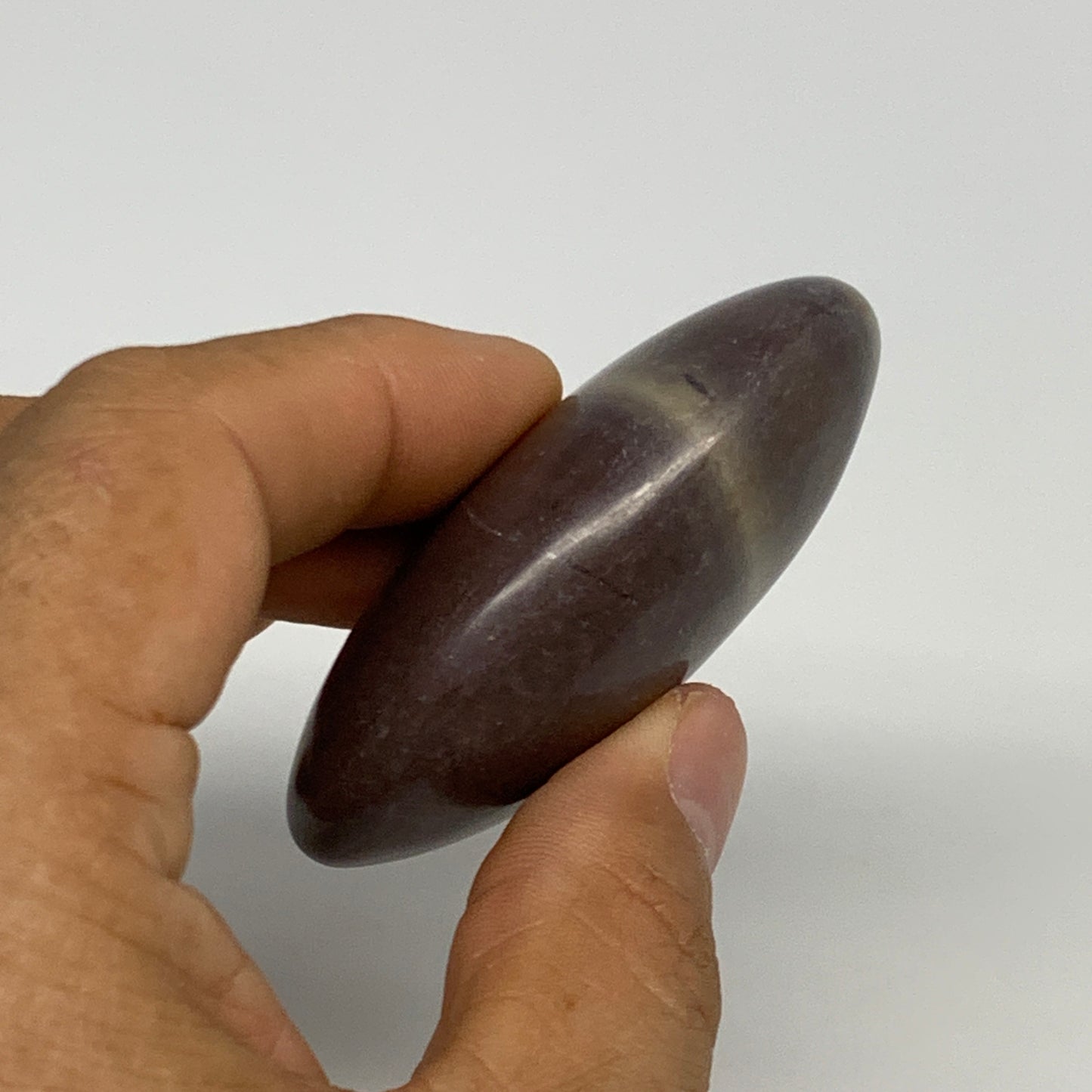 81.3g, 2.5"x1.6"x0.9", Narmada Shiva Lingam Palm-Stone Polished, B29389