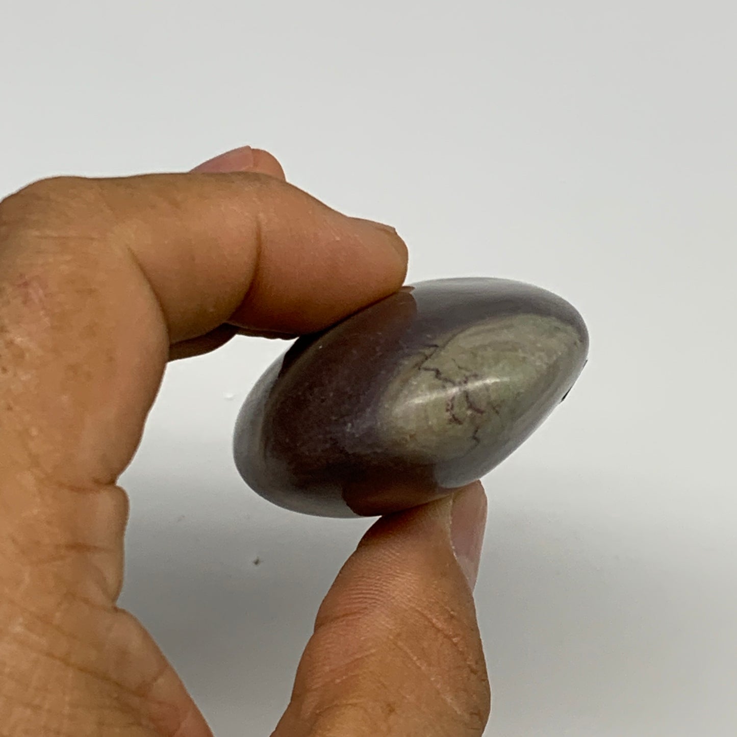 81.3g, 2.5"x1.6"x0.9", Narmada Shiva Lingam Palm-Stone Polished, B29389