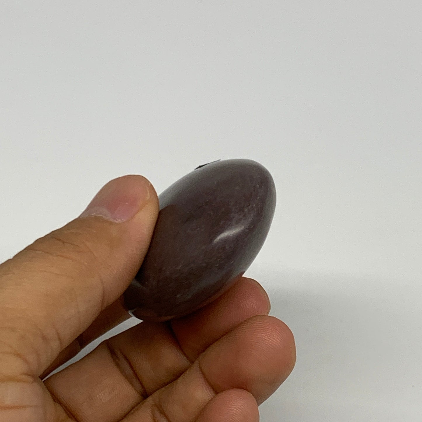 81.3g, 2.5"x1.6"x0.9", Narmada Shiva Lingam Palm-Stone Polished, B29389