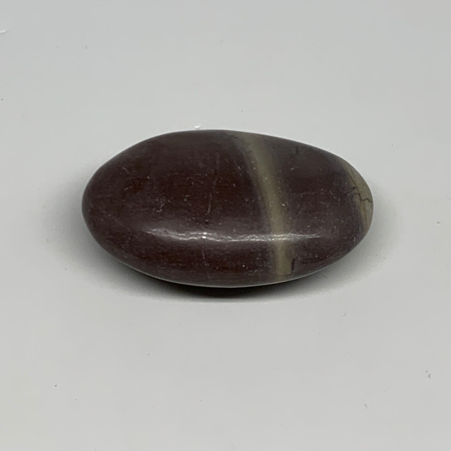 81.3g, 2.5"x1.6"x0.9", Narmada Shiva Lingam Palm-Stone Polished, B29389