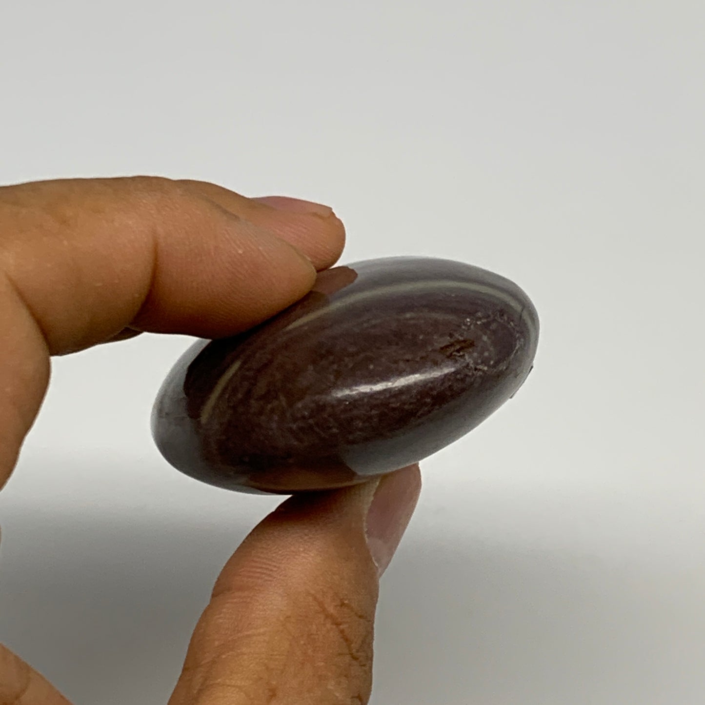 96.3g, 2.5"x1.7"x0.9", Narmada Shiva Lingam Palm-Stone Polished, B29396