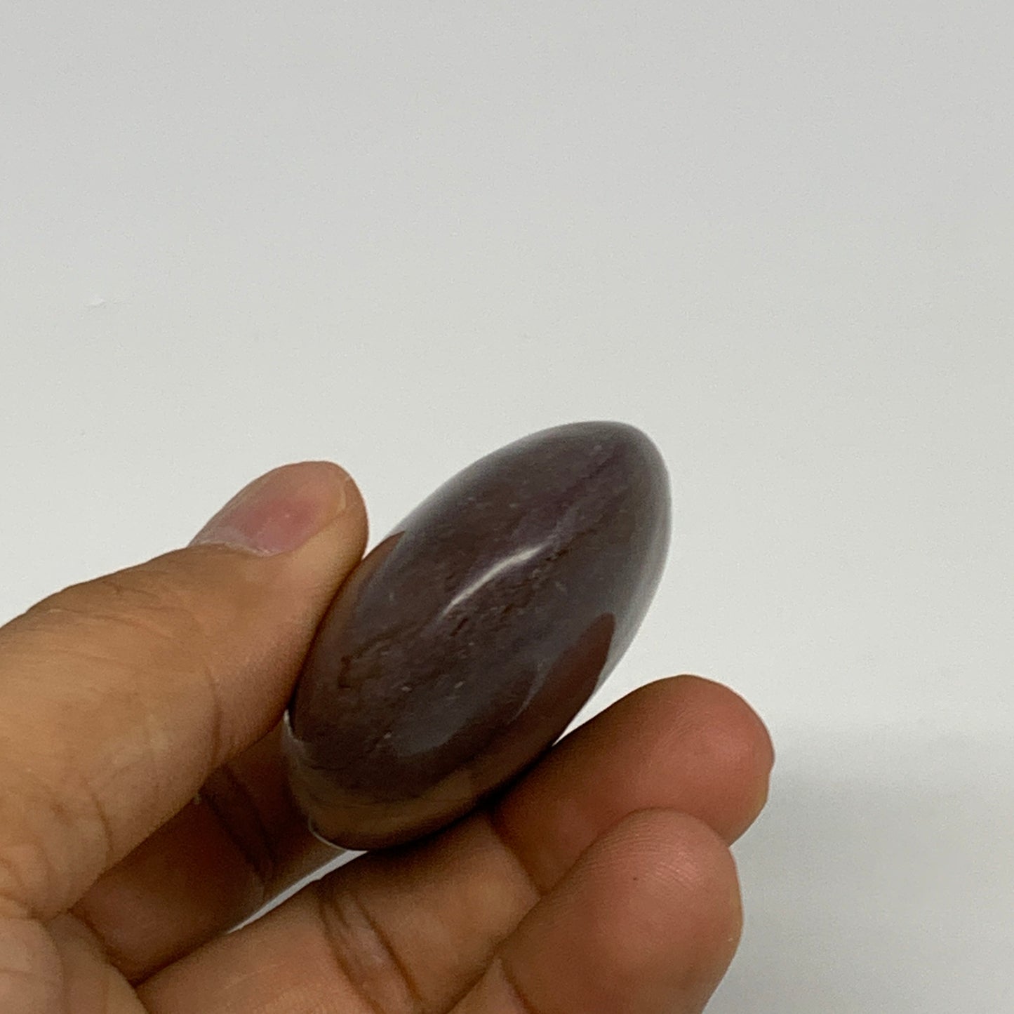 96.3g, 2.5"x1.7"x0.9", Narmada Shiva Lingam Palm-Stone Polished, B29396