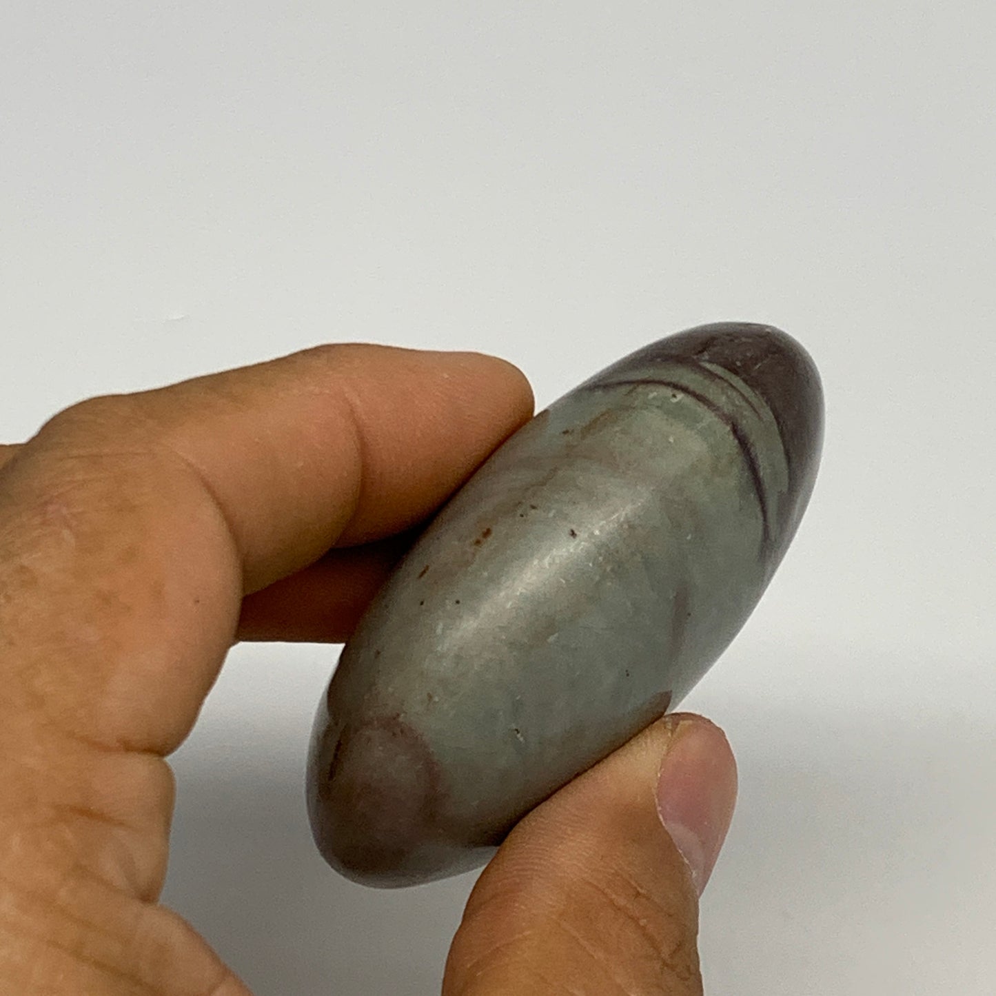 92.77g, 2.3"x1.7"x1", Narmada Shiva Lingam Palm-Stone Polished, B29397