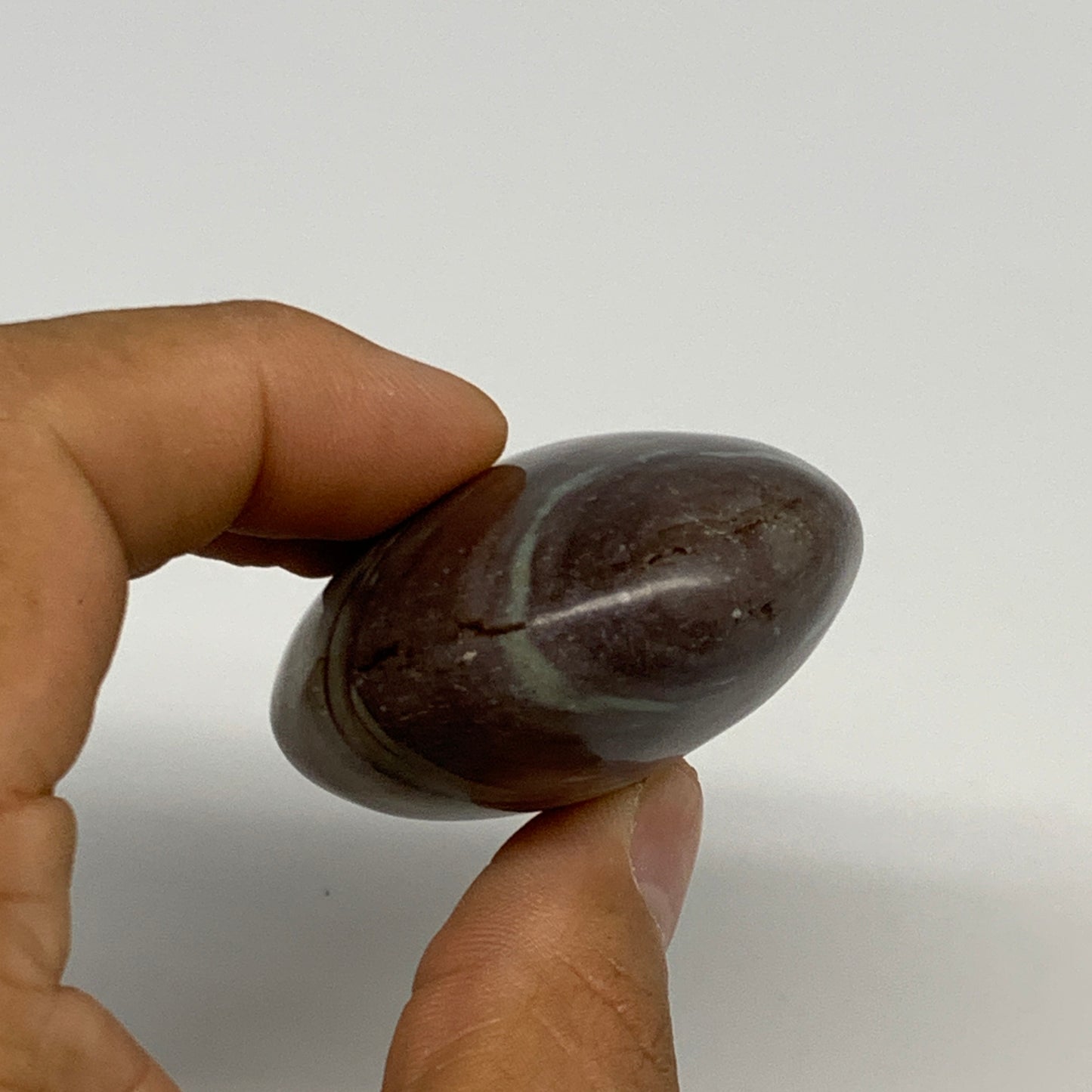 92.77g, 2.3"x1.7"x1", Narmada Shiva Lingam Palm-Stone Polished, B29397