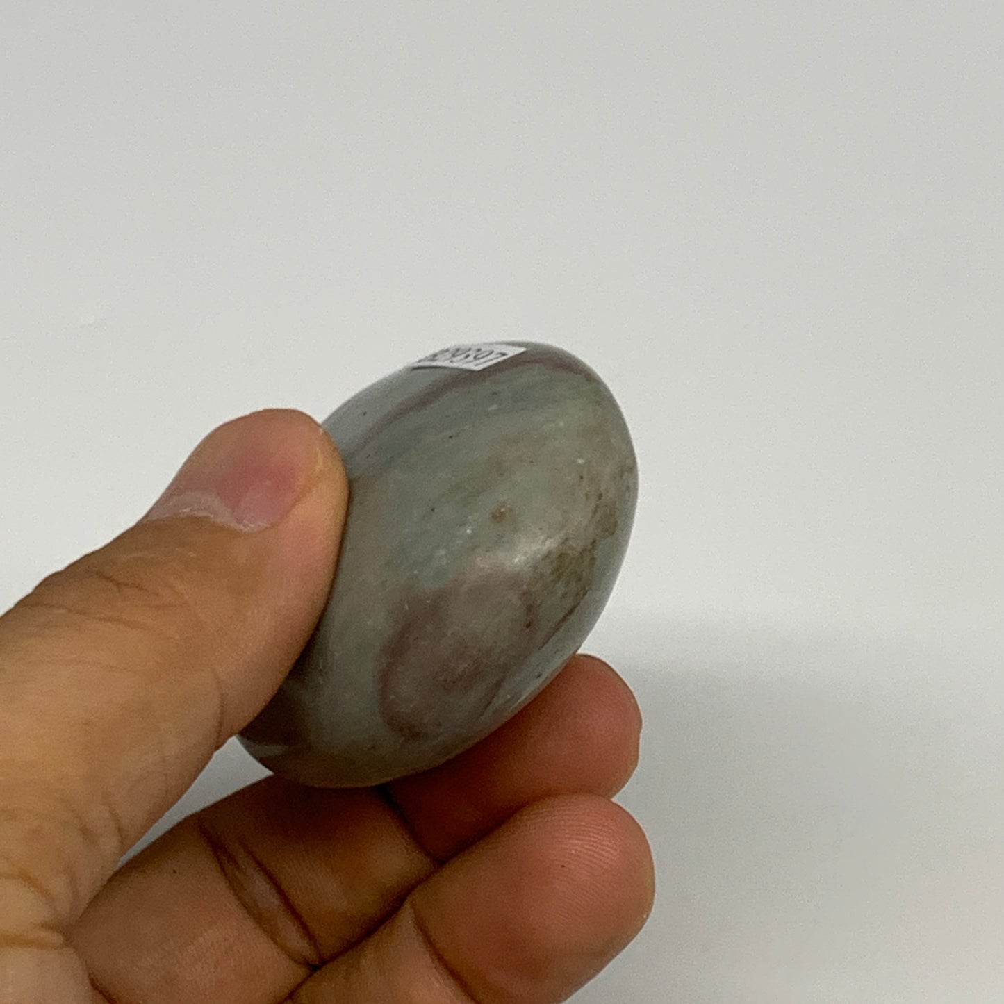 92.77g, 2.3"x1.7"x1", Narmada Shiva Lingam Palm-Stone Polished, B29397