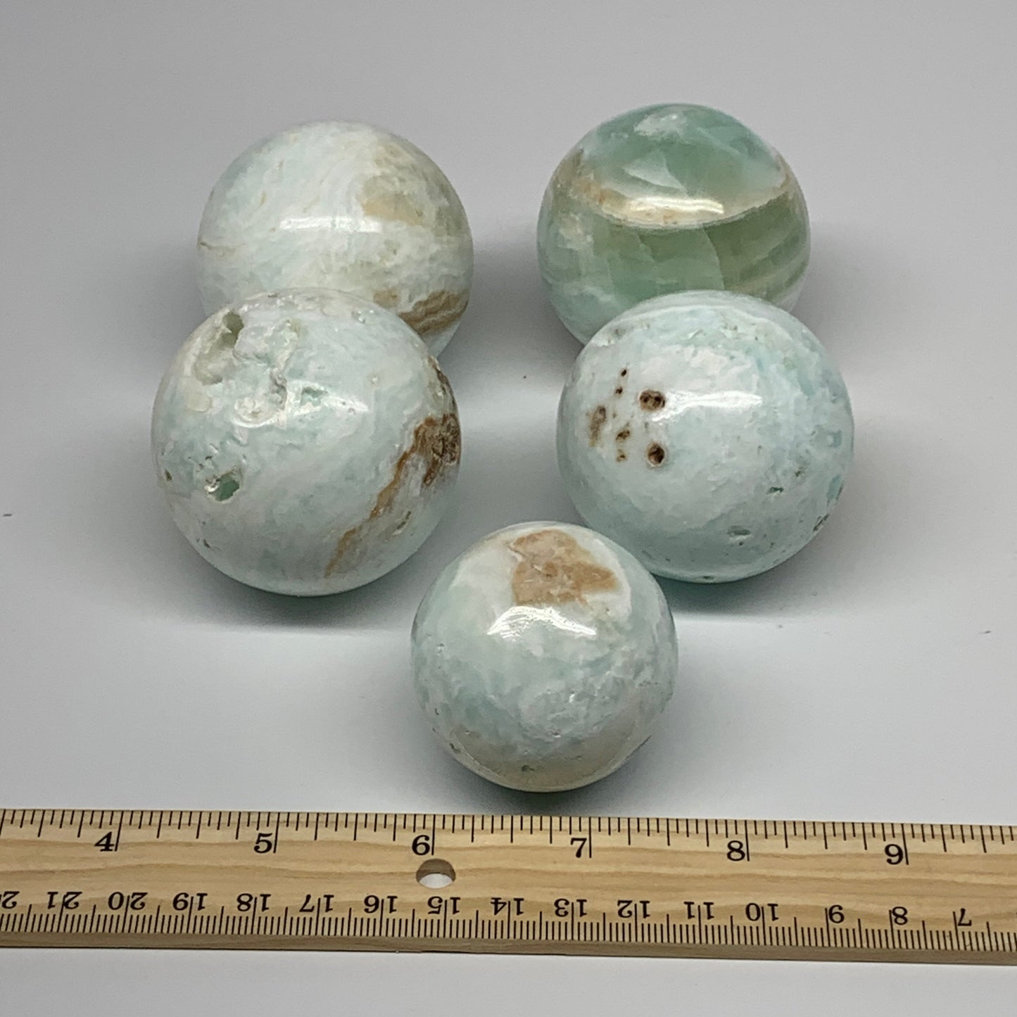 2.2 lbs, 1.7" - 2.2", 5pcs Caribbean Calcite Spheres Gemstones, B25195