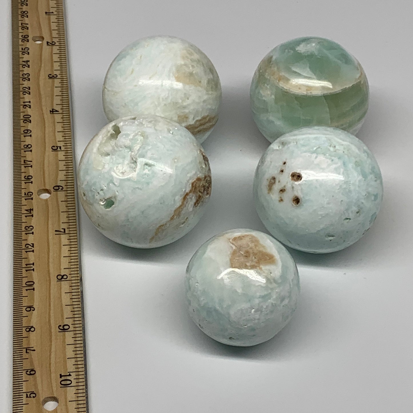 2.2 lbs, 1.7" - 2.2", 5pcs Caribbean Calcite Spheres Gemstones, B25195