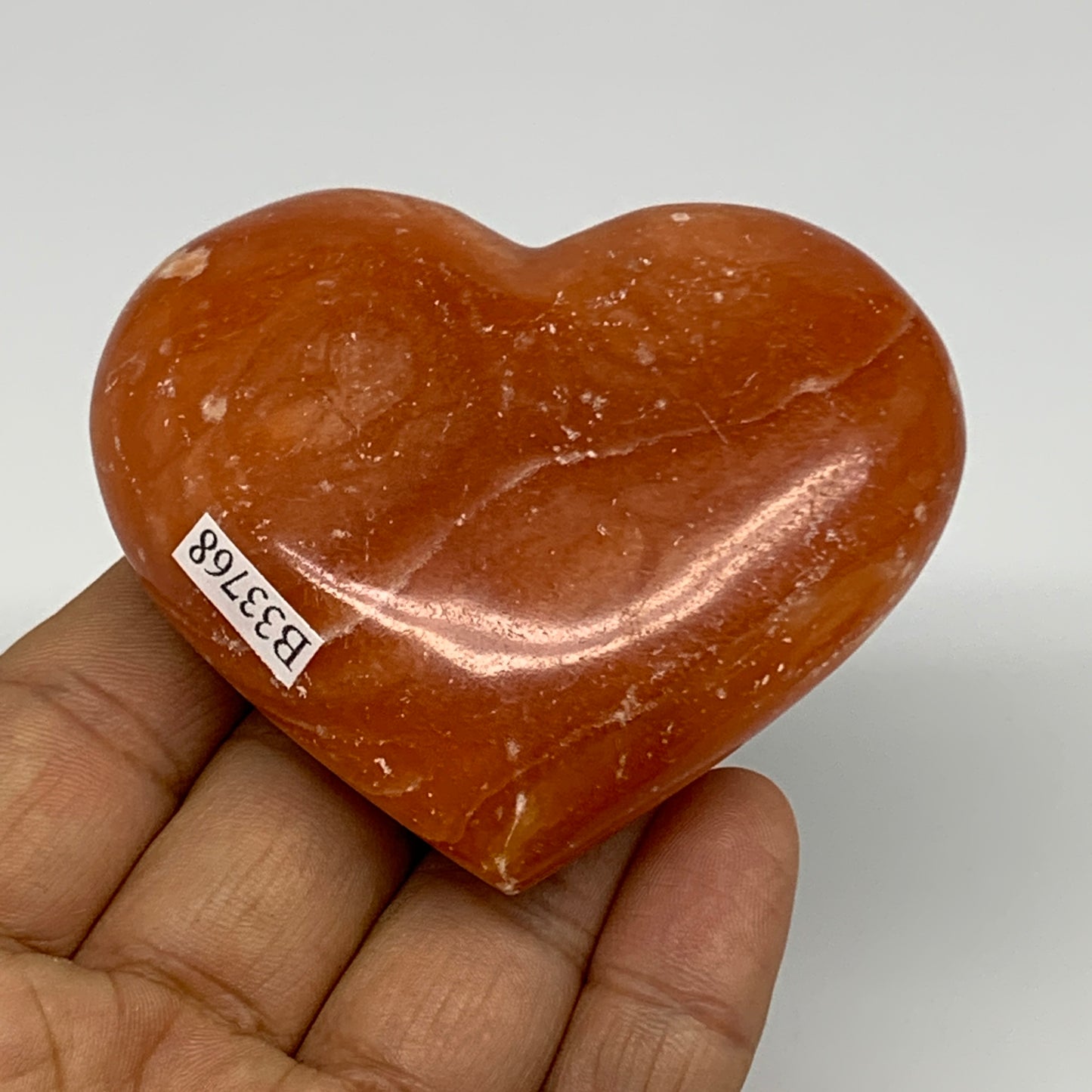 123.5g, 2.3"x2.7"x1" Orange Calcite Heart Gemstones from Madagascar, B33768