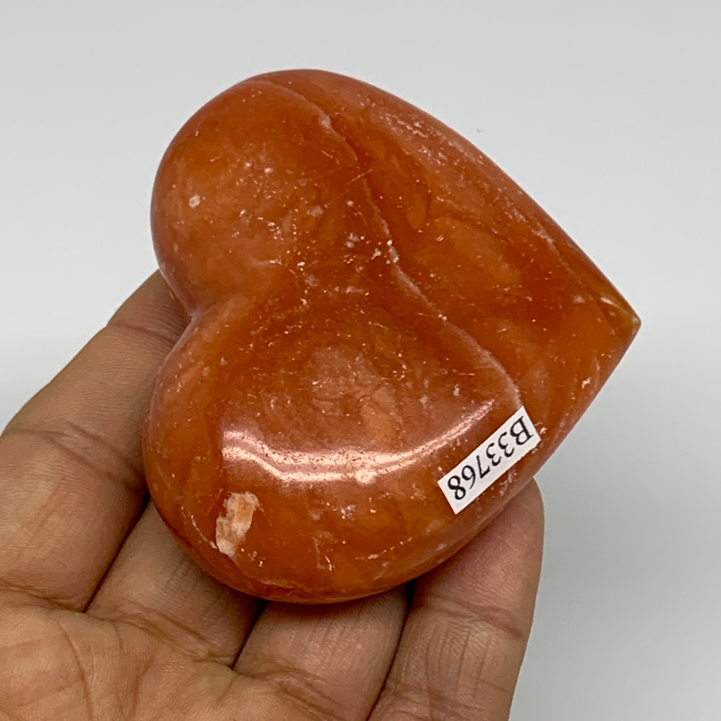 123.5g, 2.3"x2.7"x1" Orange Calcite Heart Gemstones from Madagascar, B33768