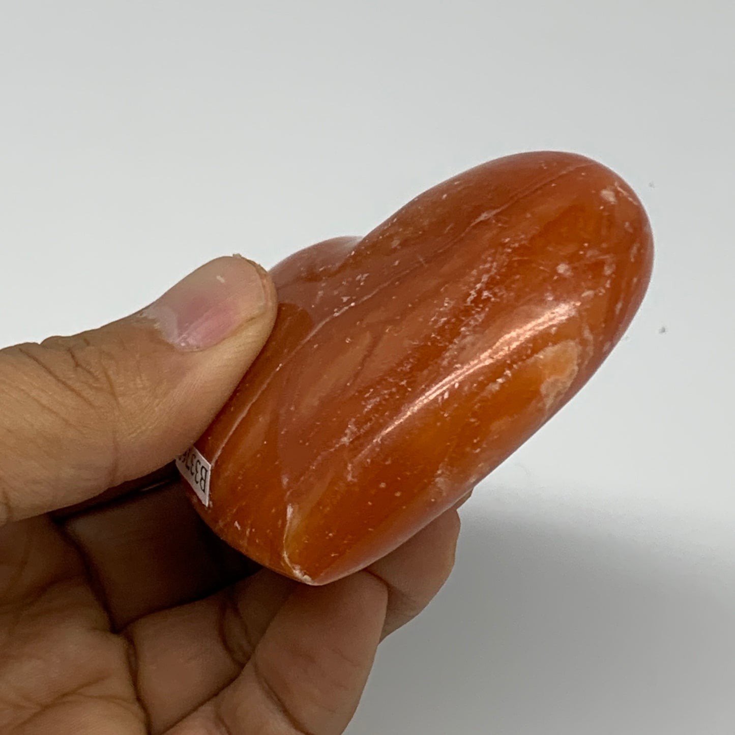 123.5g, 2.3"x2.7"x1" Orange Calcite Heart Gemstones from Madagascar, B33768