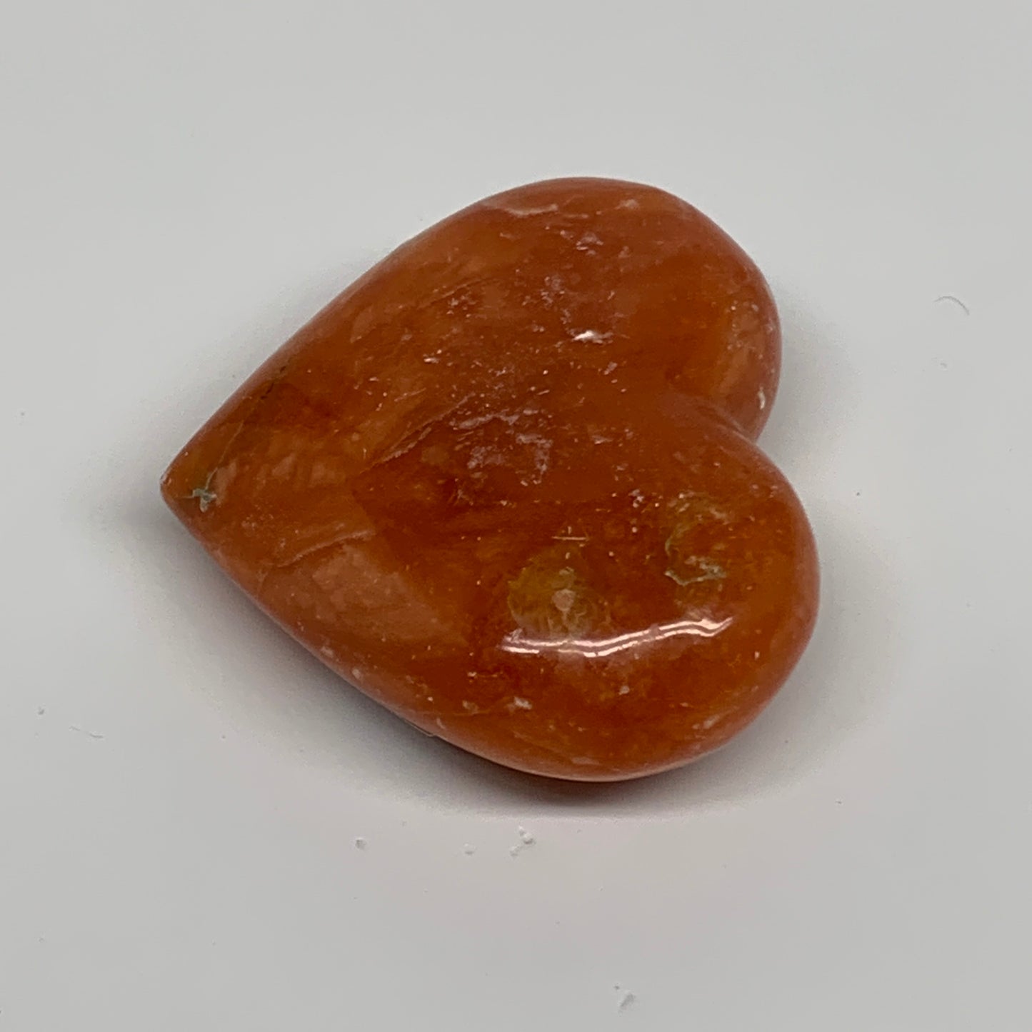 123.5g, 2.3"x2.7"x1" Orange Calcite Heart Gemstones from Madagascar, B33768