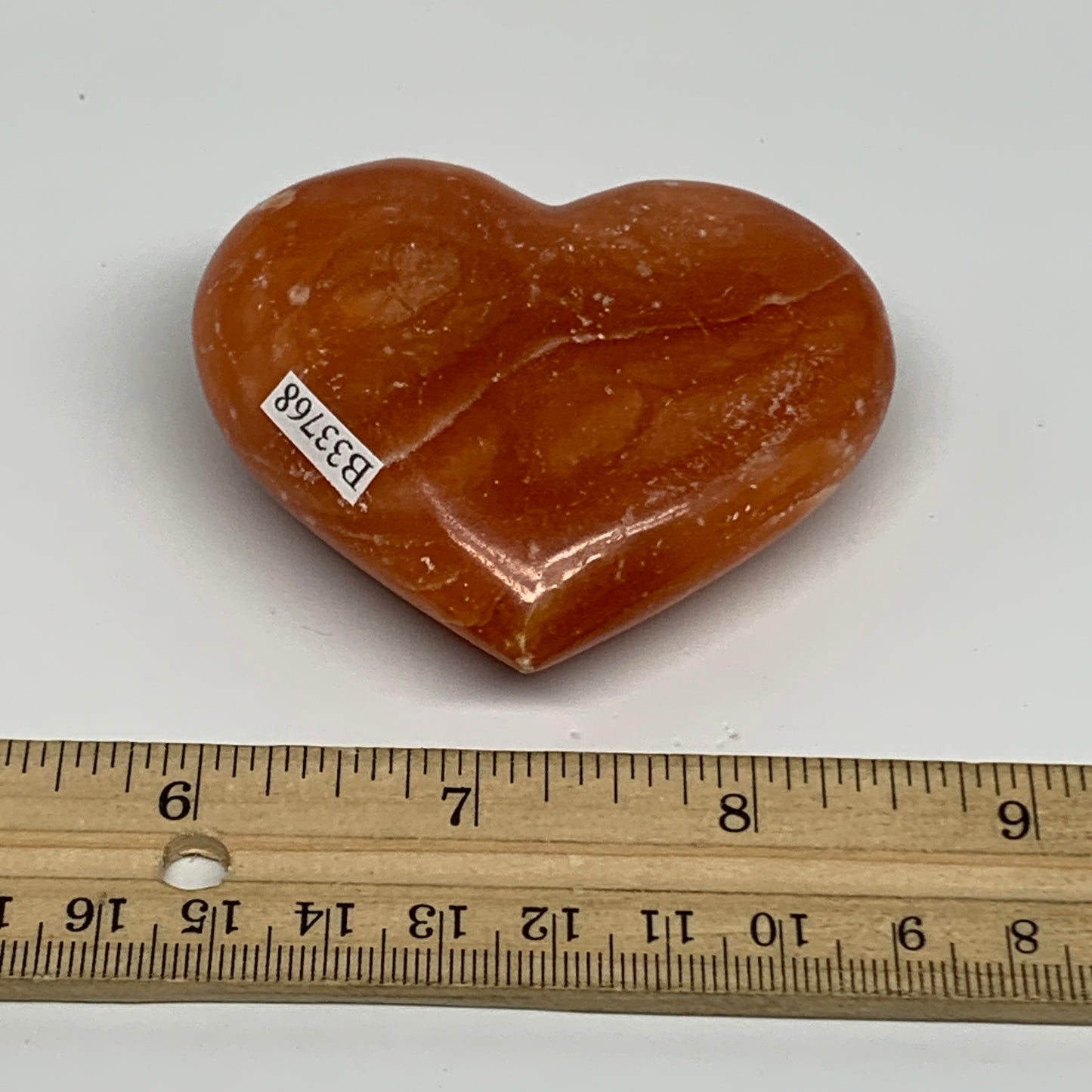 123.5g, 2.3"x2.7"x1" Orange Calcite Heart Gemstones from Madagascar, B33768