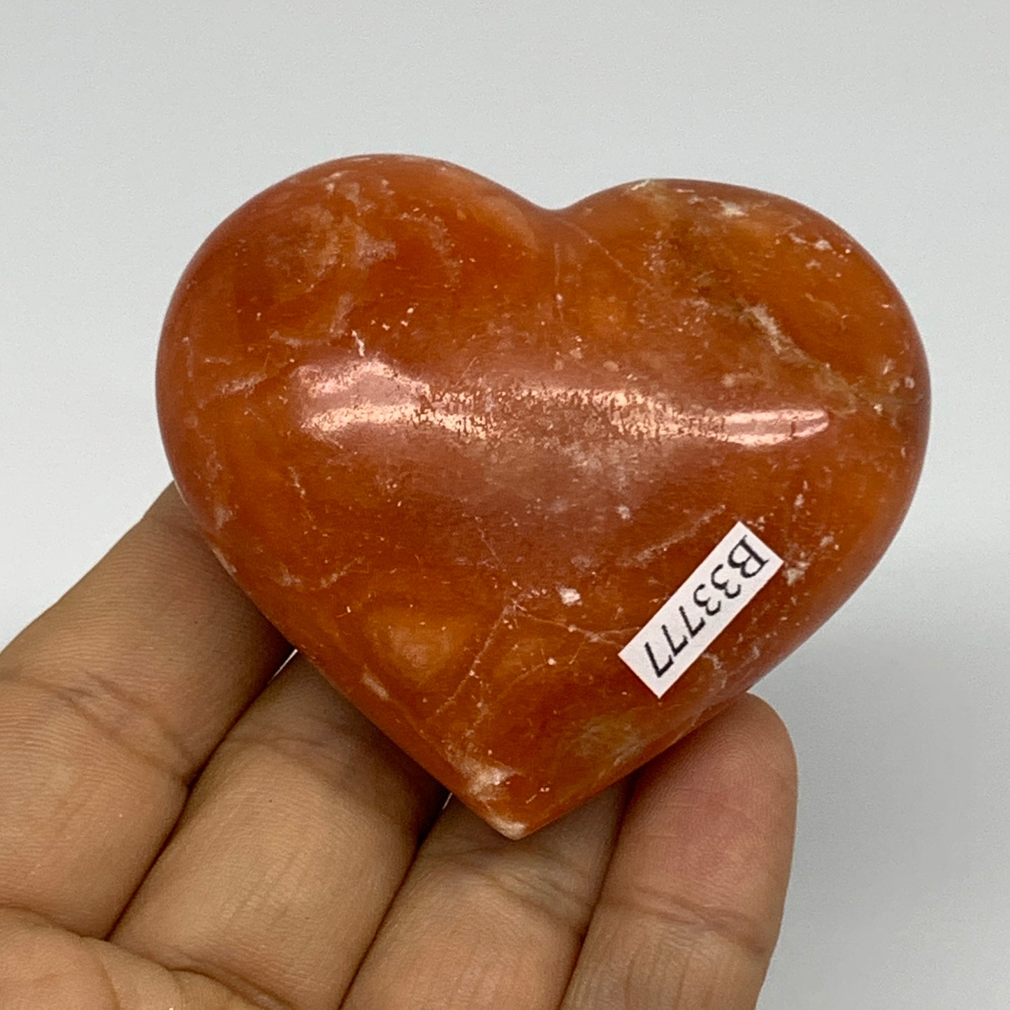 117.8g, 2.2"x2.5"x1.1" Orange Calcite Heart Gemstones from Madagascar, B33777