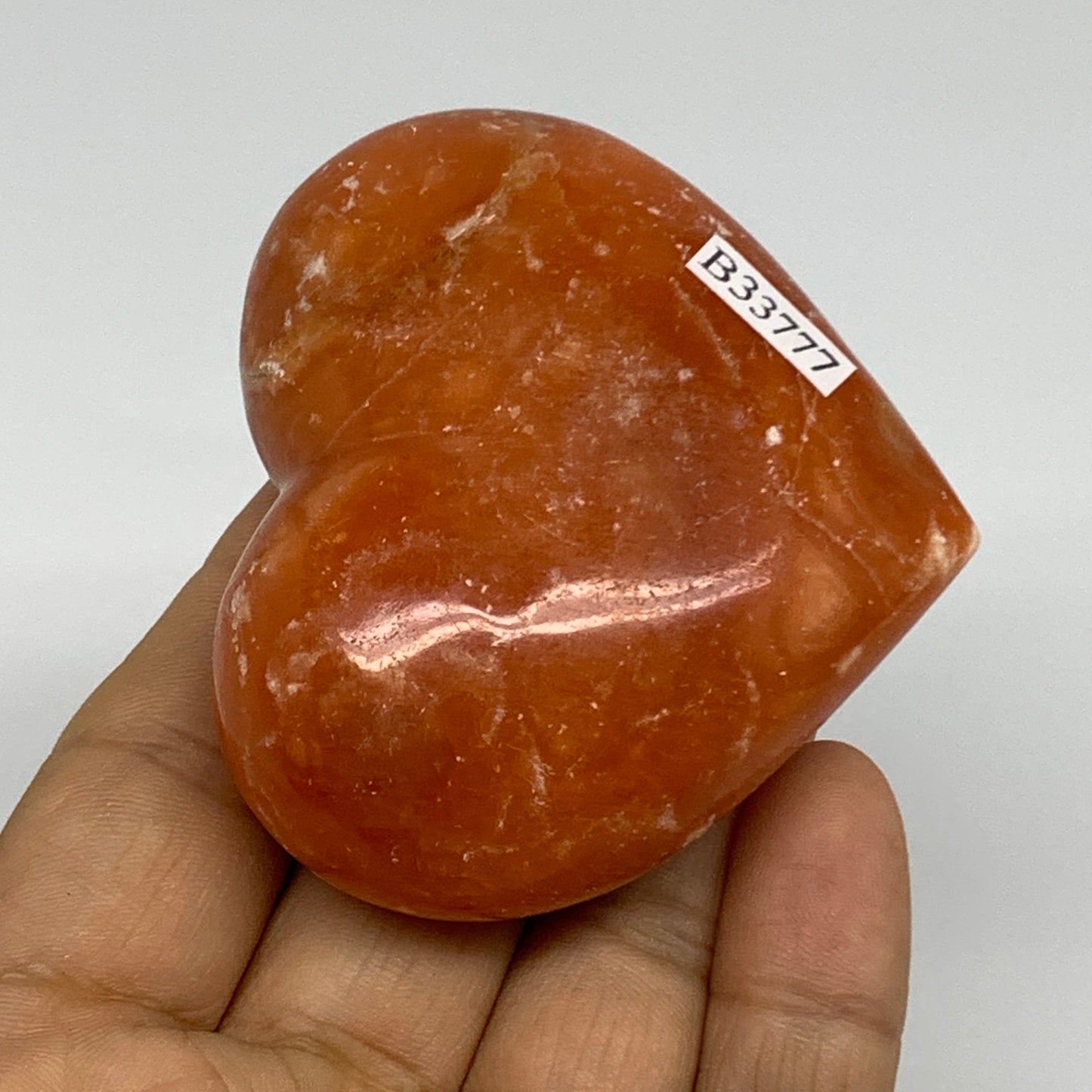 117.8g, 2.2"x2.5"x1.1" Orange Calcite Heart Gemstones from Madagascar, B33777