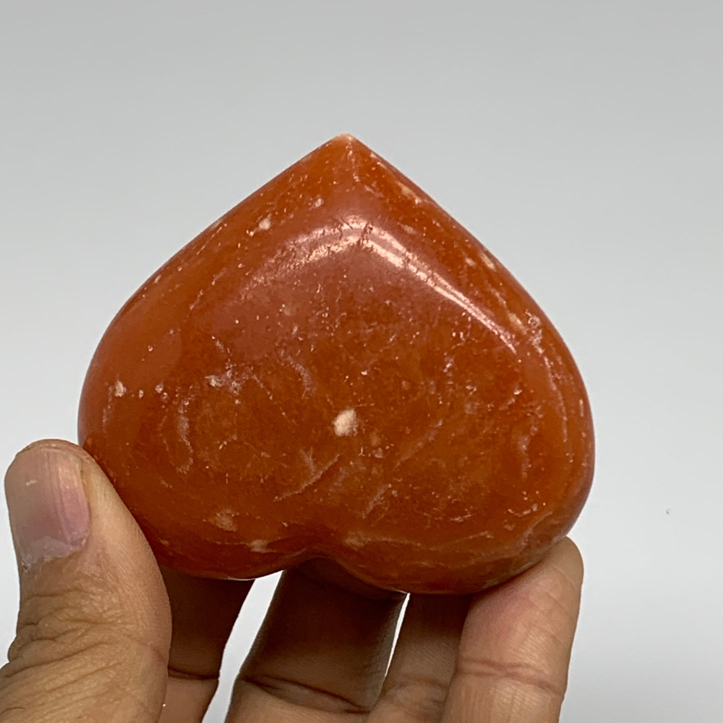 117.8g, 2.2"x2.5"x1.1" Orange Calcite Heart Gemstones from Madagascar, B33777