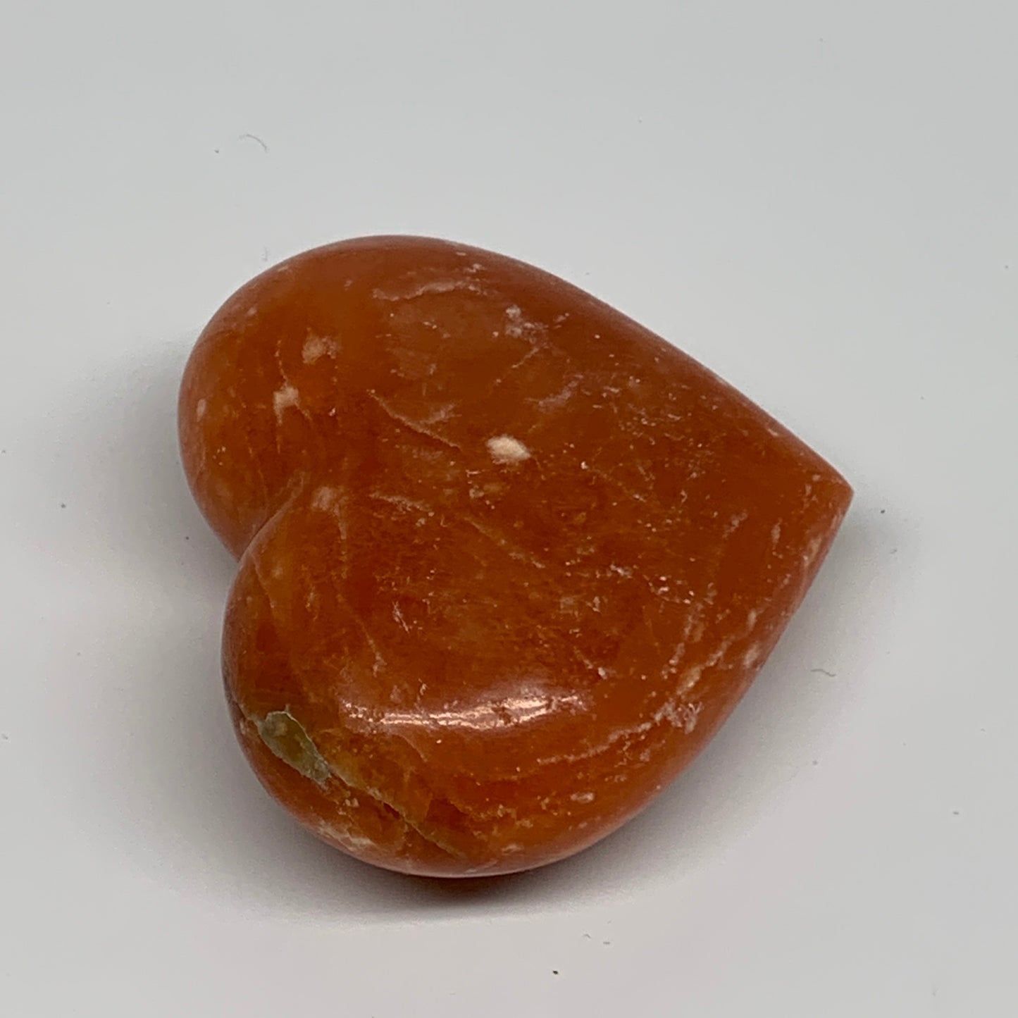 117.8g, 2.2"x2.5"x1.1" Orange Calcite Heart Gemstones from Madagascar, B33777