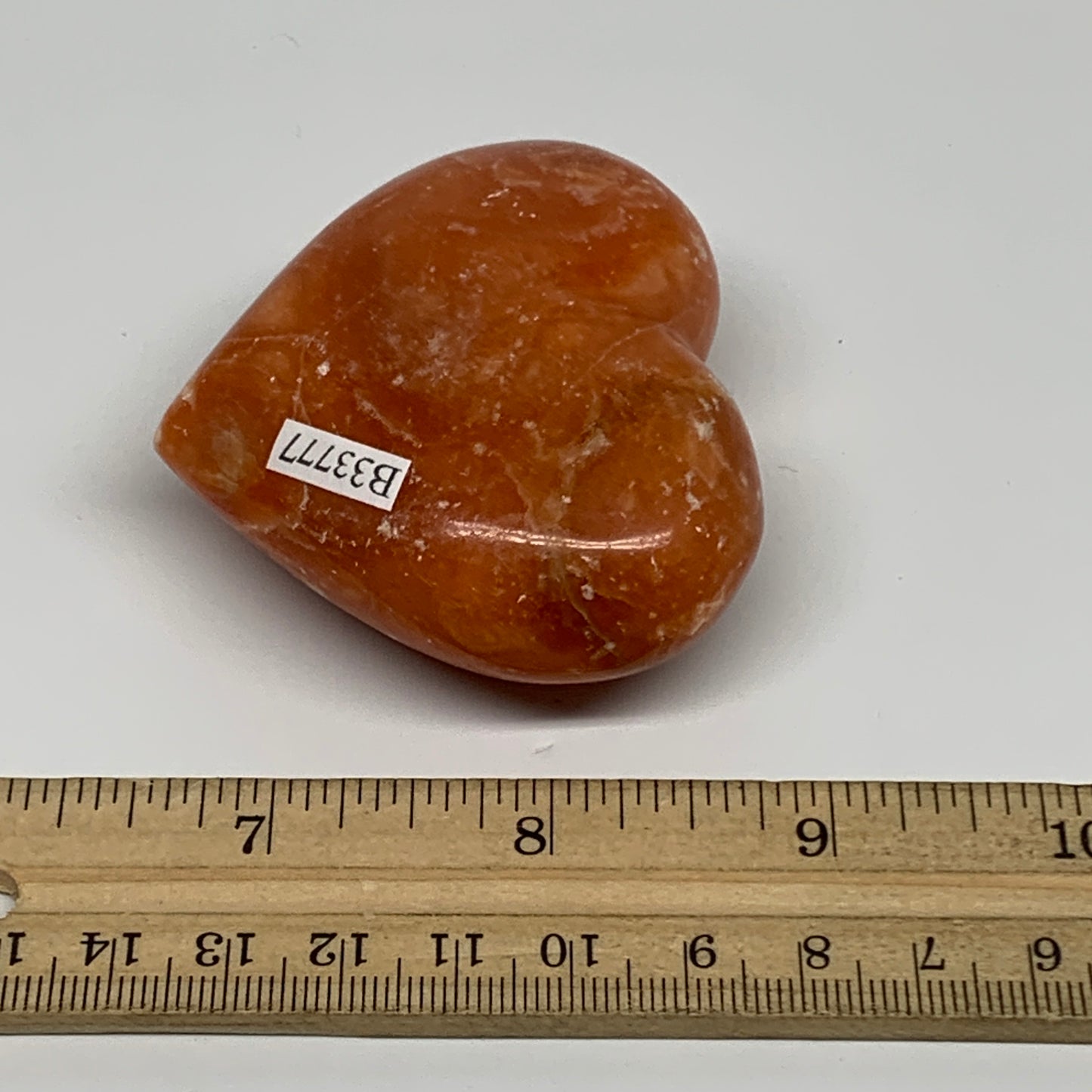 117.8g, 2.2"x2.5"x1.1" Orange Calcite Heart Gemstones from Madagascar, B33777