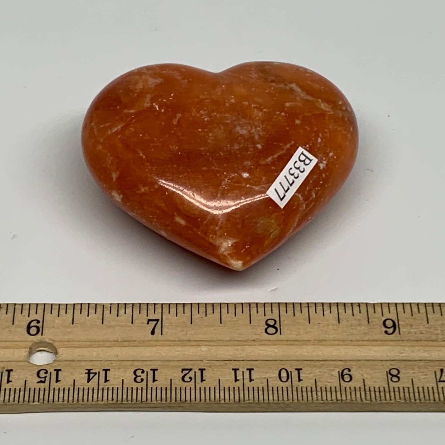 117.8g, 2.2"x2.5"x1.1" Orange Calcite Heart Gemstones from Madagascar, B33777