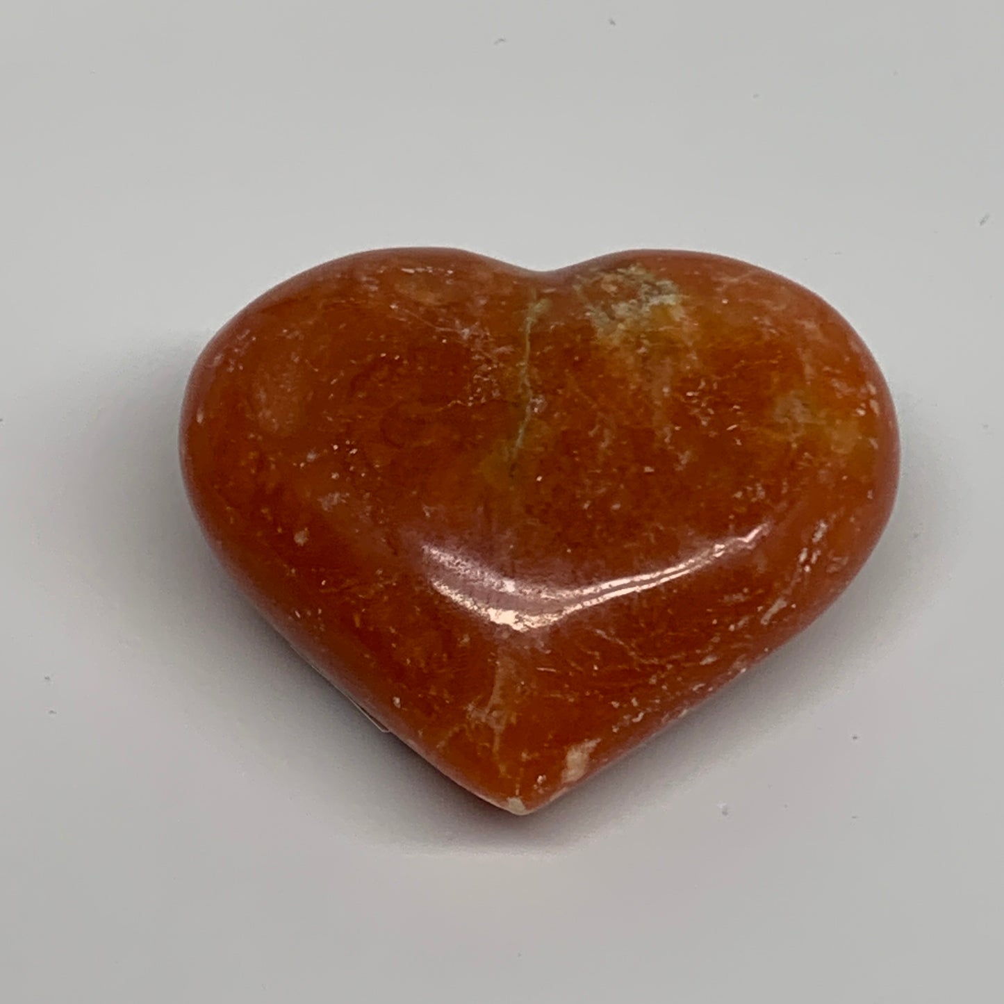 131.3g, 2.3"x2.7"x1.2" Orange Calcite Heart Gemstones from Madagascar, B33788