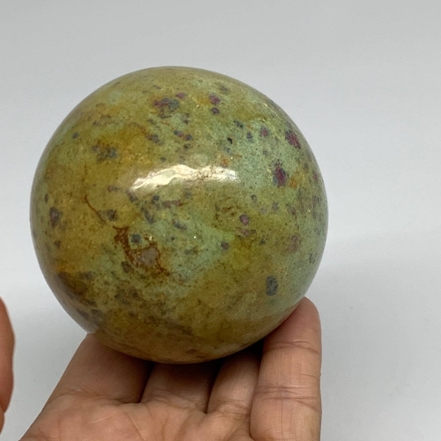 1.26 lbs, 2.8"(72mm), Zoisite with Ruby Sphere Sphere Ball Crystal, B25208