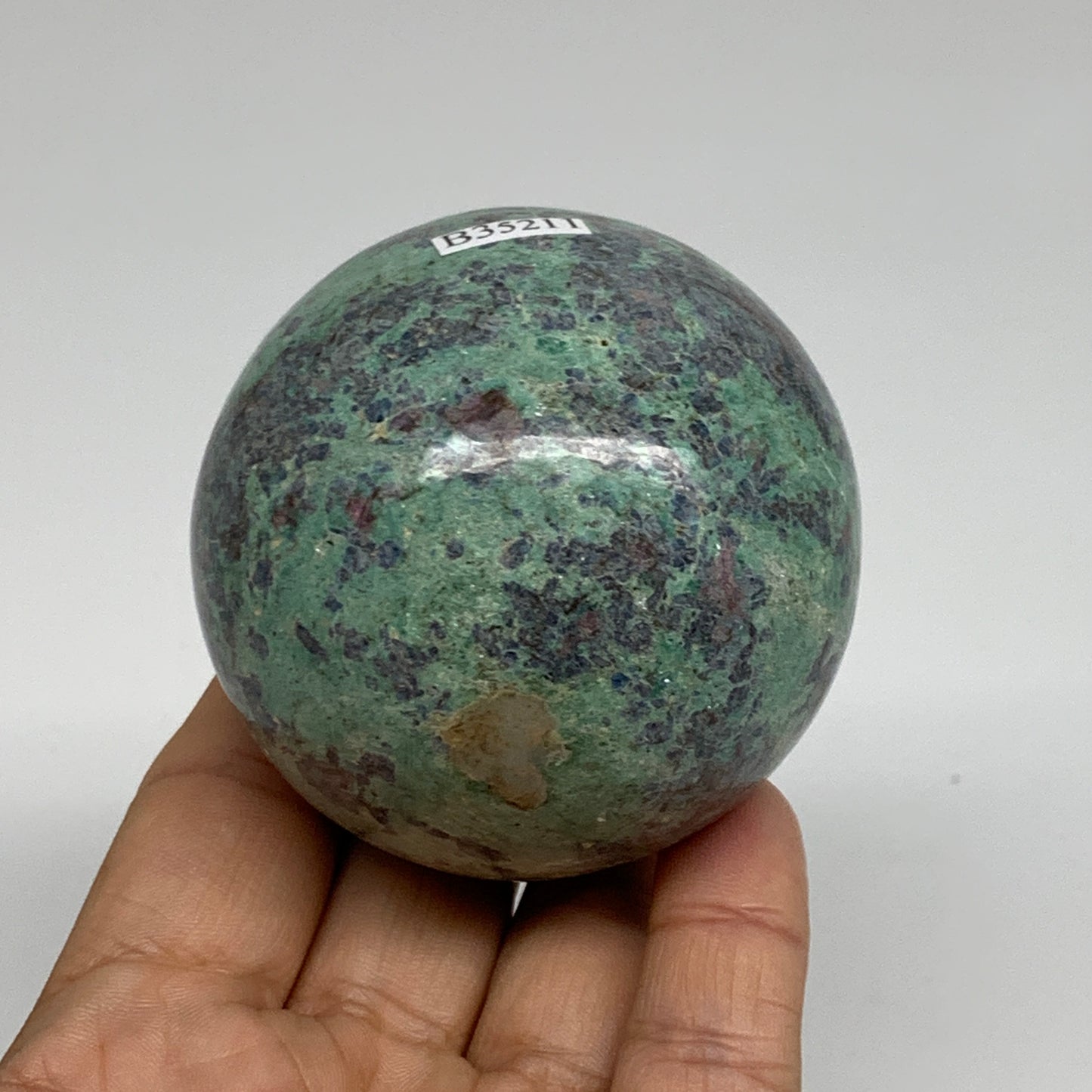 0.88 lbs, 2.4"(61mm), Zoisite with Ruby Sphere Sphere Ball Crystal, B25211