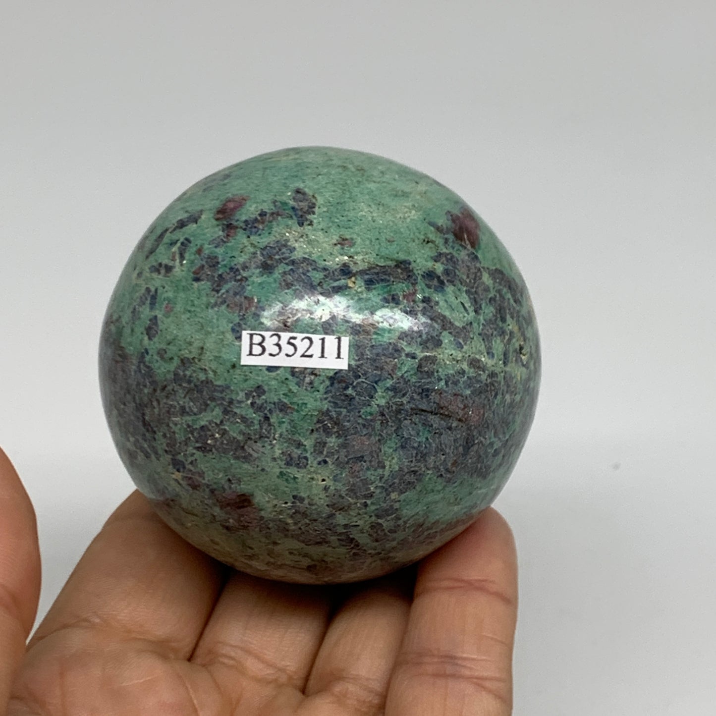 0.88 lbs, 2.4"(61mm), Zoisite with Ruby Sphere Sphere Ball Crystal, B25211