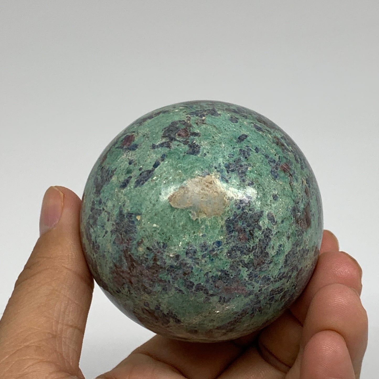 0.88 lbs, 2.4"(61mm), Zoisite with Ruby Sphere Sphere Ball Crystal, B25211