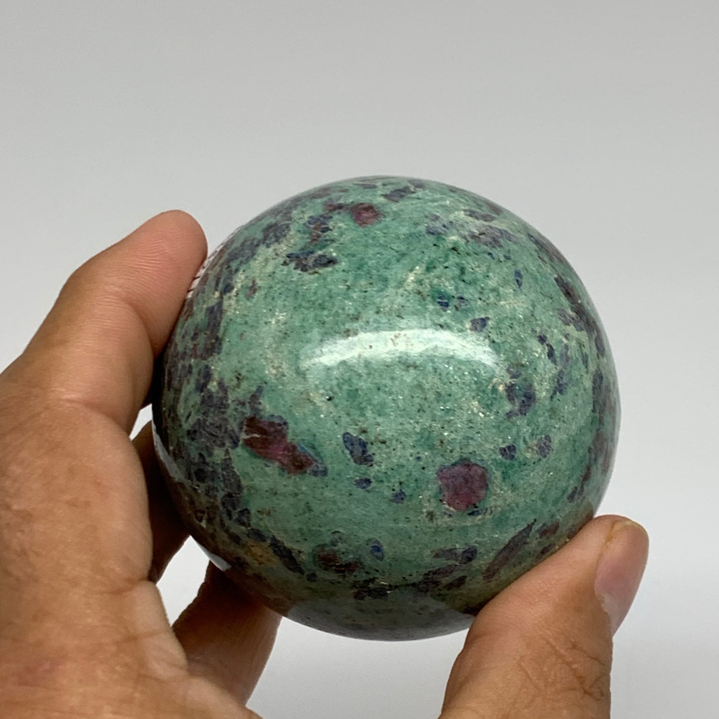 0.88 lbs, 2.4"(61mm), Zoisite with Ruby Sphere Sphere Ball Crystal, B25211