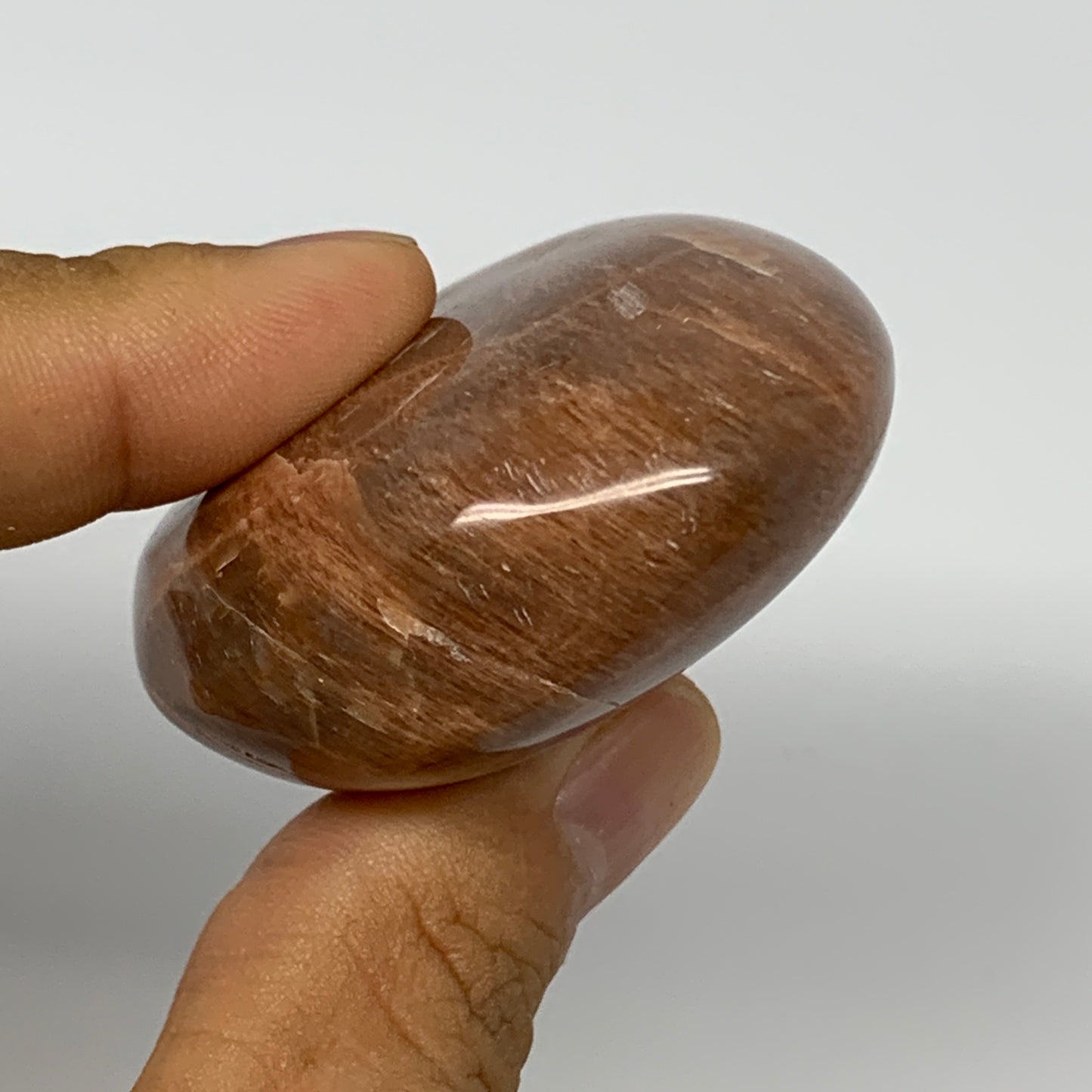 98.5g,2.4"x1.9"x1", Peach Moonstone Palm-Stone Polished Reiki Crystal, B15484