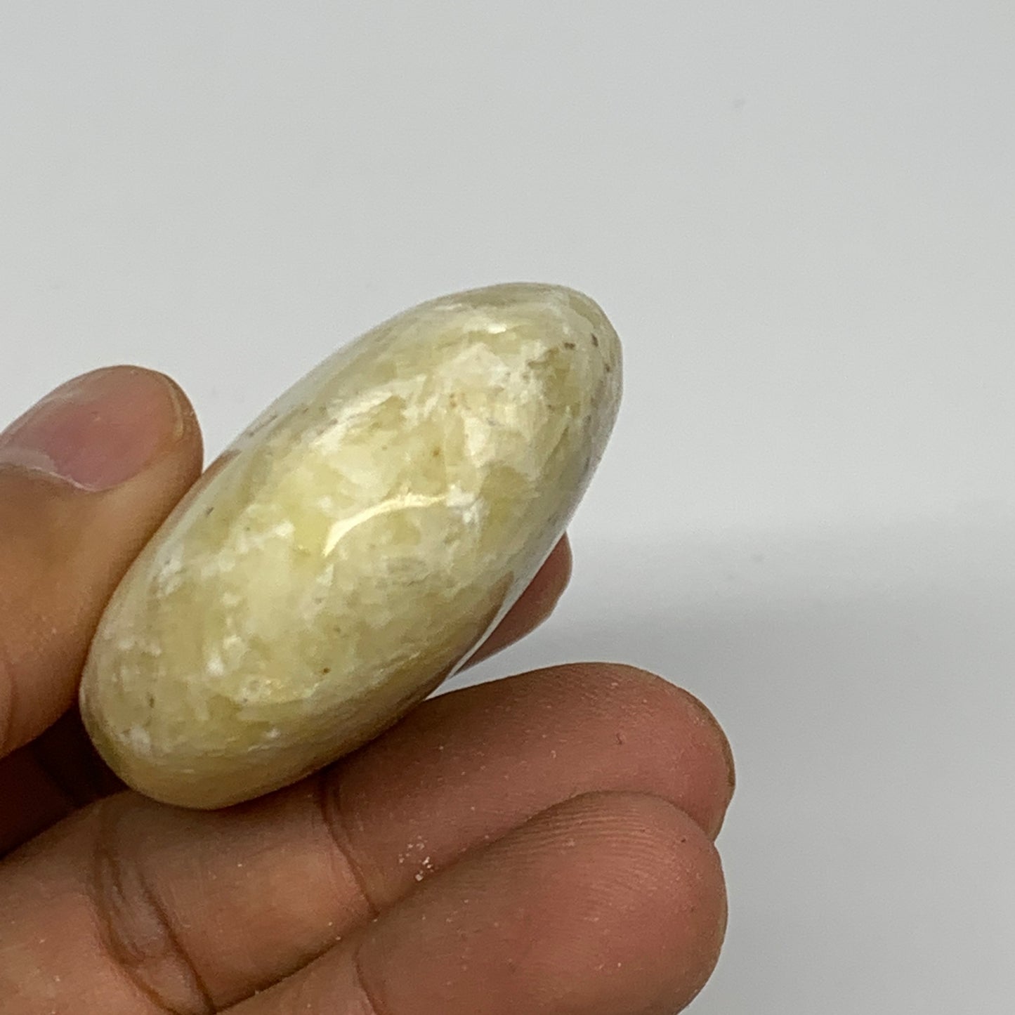 78.3g, 2.3"x1.6"x0.8", Natural Yellow Calcite Palm-Stone Crystal Polished Reiki,